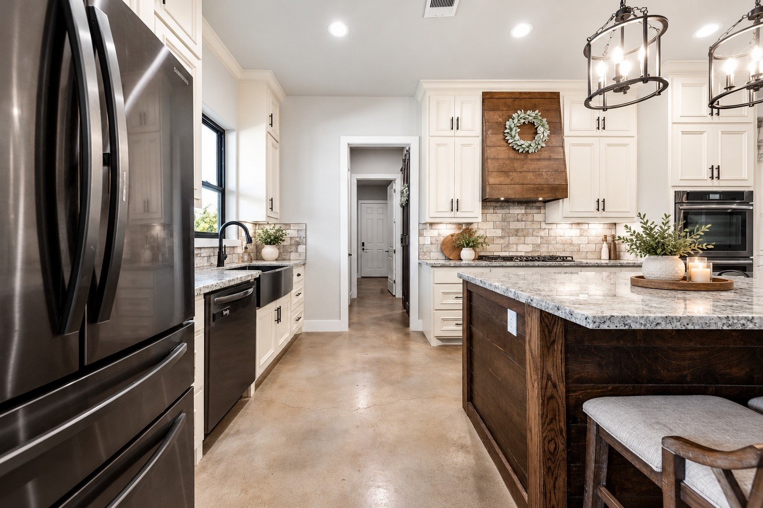 Kitchen with stainless refrigerator, dishwasher, granite counters and a walk-in pantry nearby. This photo may be edited using AI tools.