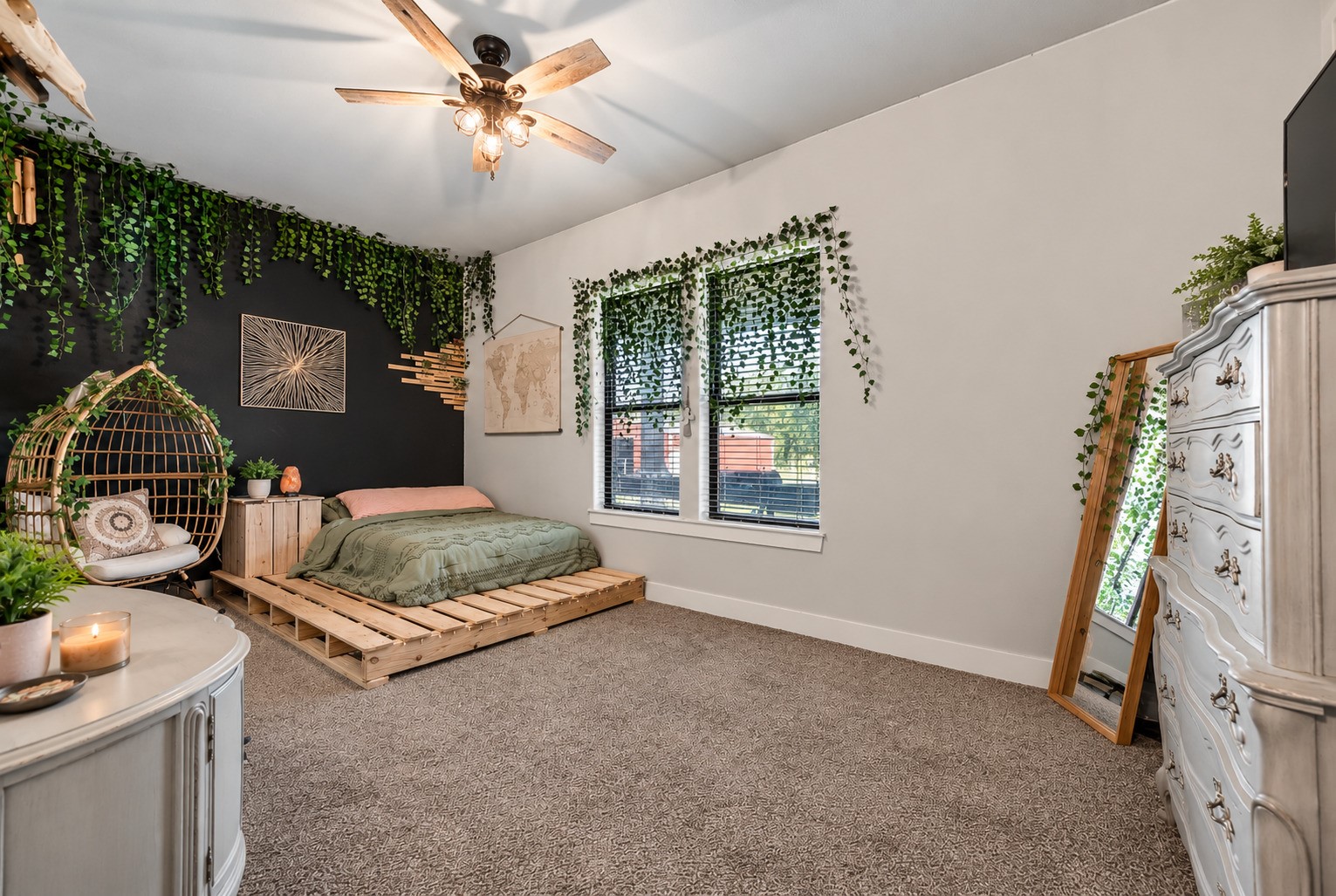 Secondary bedroom with carpet, ceiling fan and natural light; flexible space for guests, an office or hobbies. This photo may be edited using AI tools.