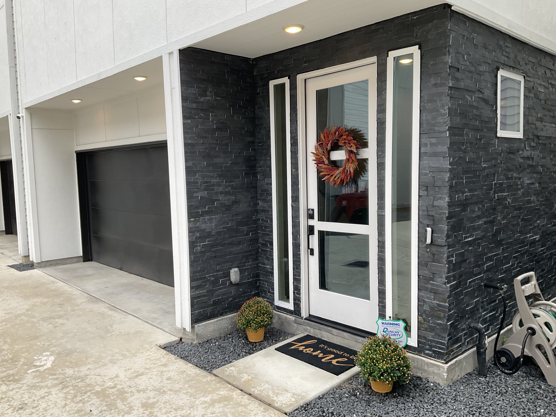 Front door with slate tile trim.