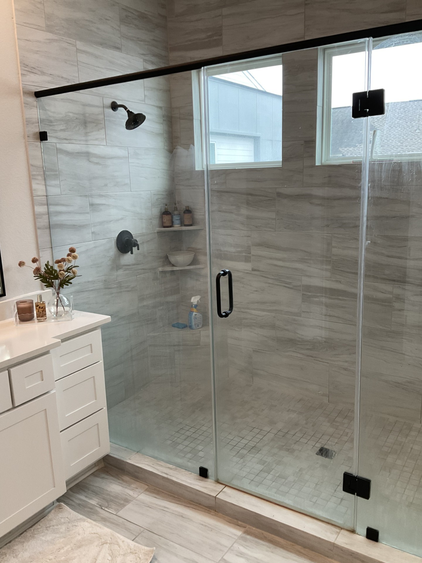 A dual head showerwith lots of light.