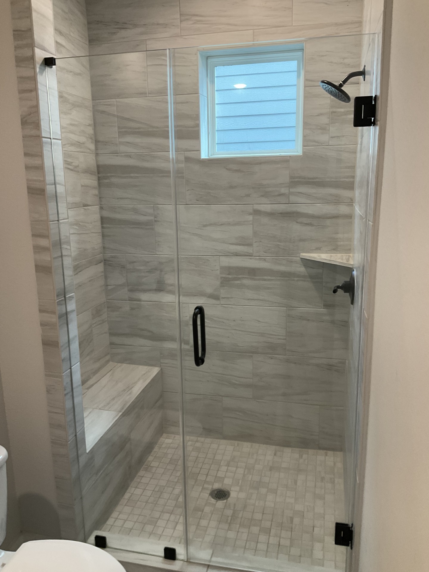3rd bedroom bath has a great shower with seat.