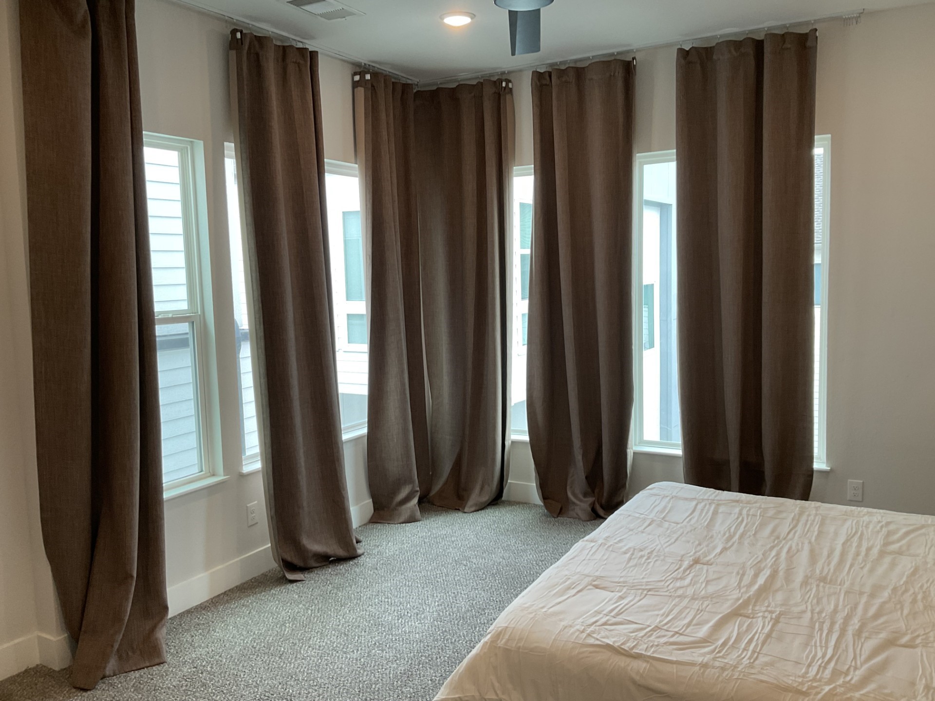 Master bedroom with lots of light. Drapes will be removed. Rods will stay.