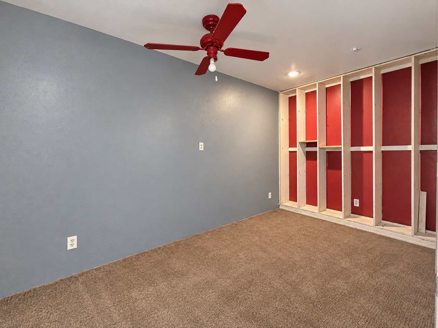 Shelving on both ends of the room