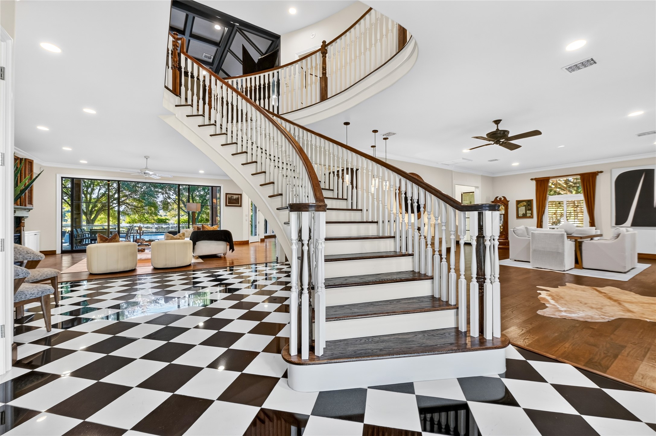 This grand entry staircase at the front of the home evokes a strong sense of character that carries through every room of this home.