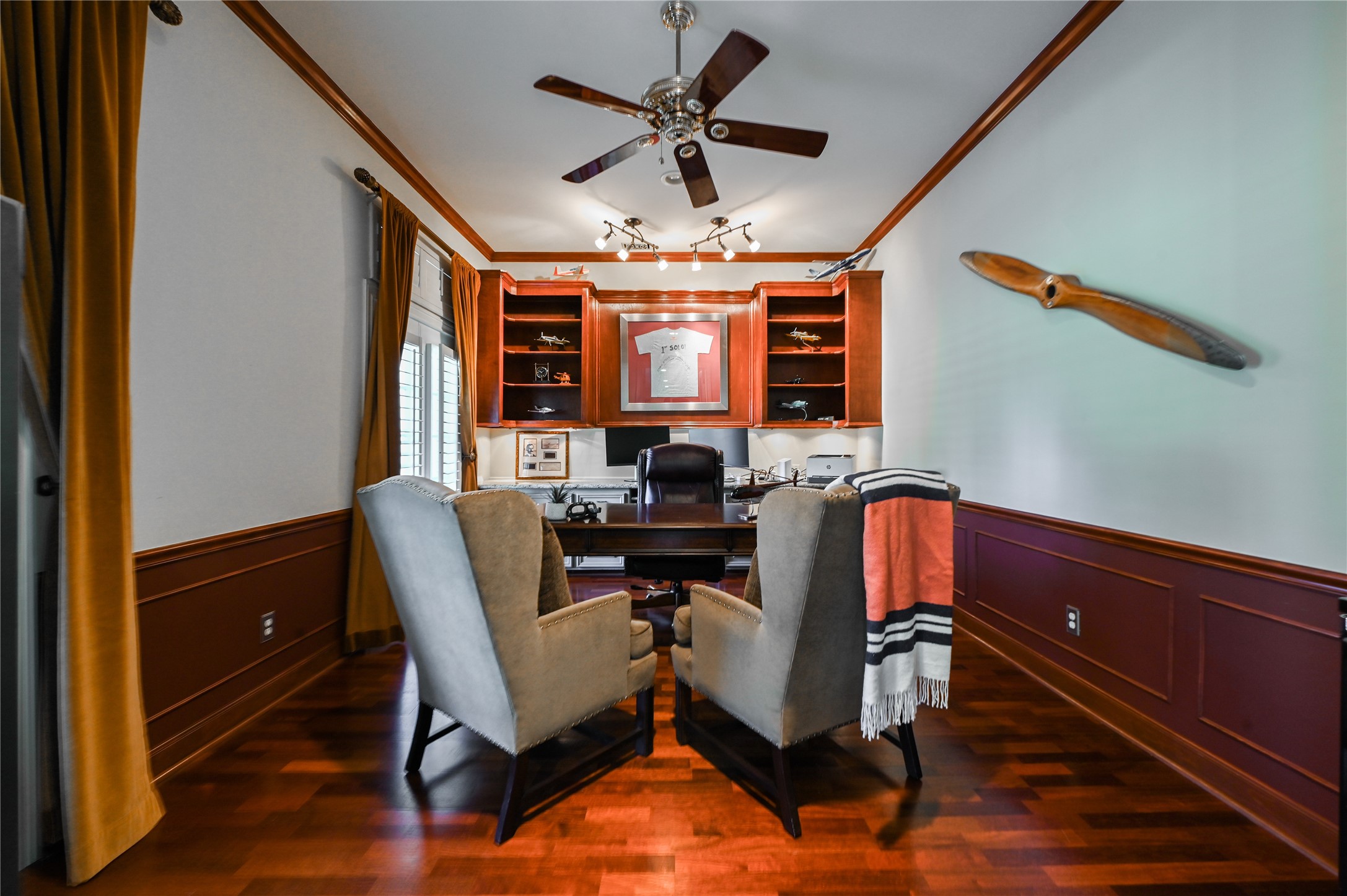 The office is located downstairs at the front of the home.