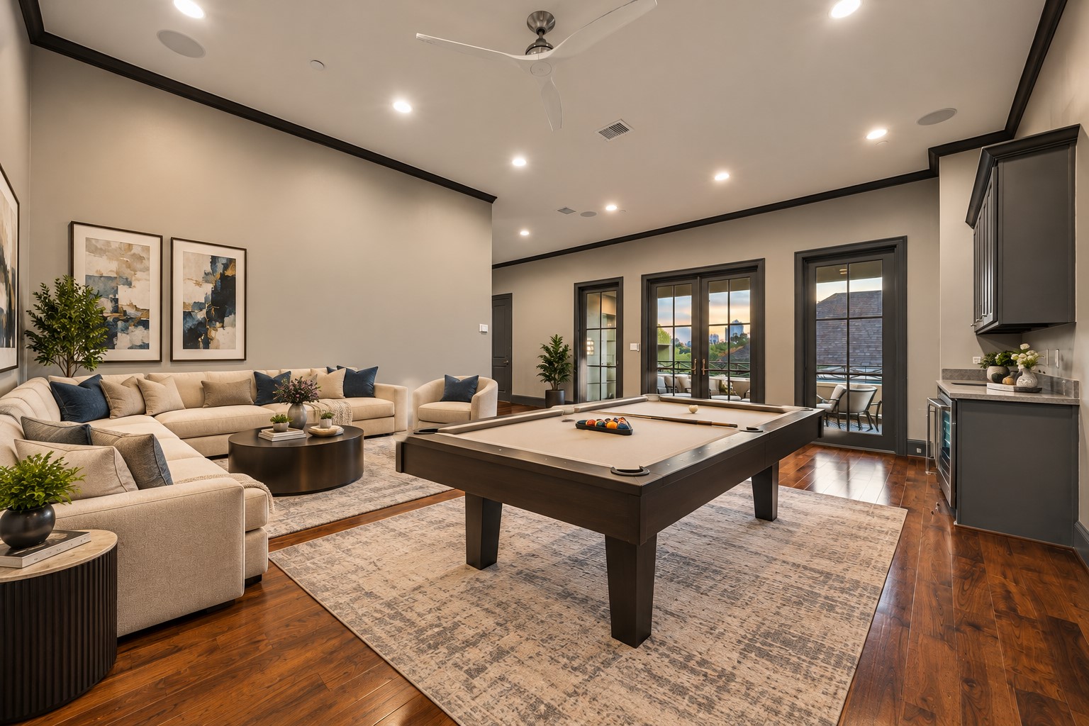 Spacious fourth-floor covered terrace featuring motorized retractable screens, multiple French doors, ample room for outdoor lounging, and Houston skyline viewsperfect for relaxing or entertaining.