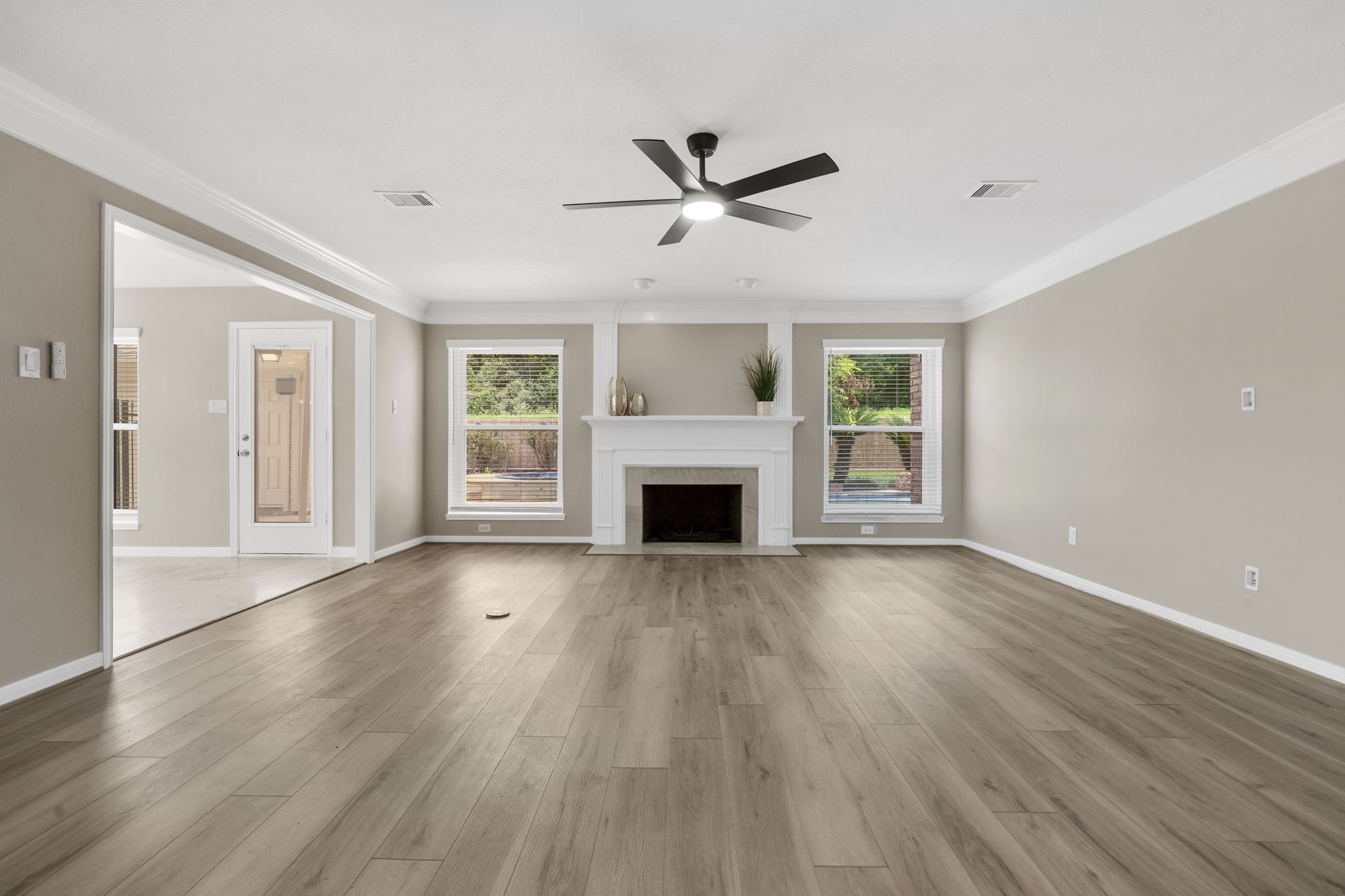 An open connection to the kitchen and breakfast area creates an effortless flow for everyday living.