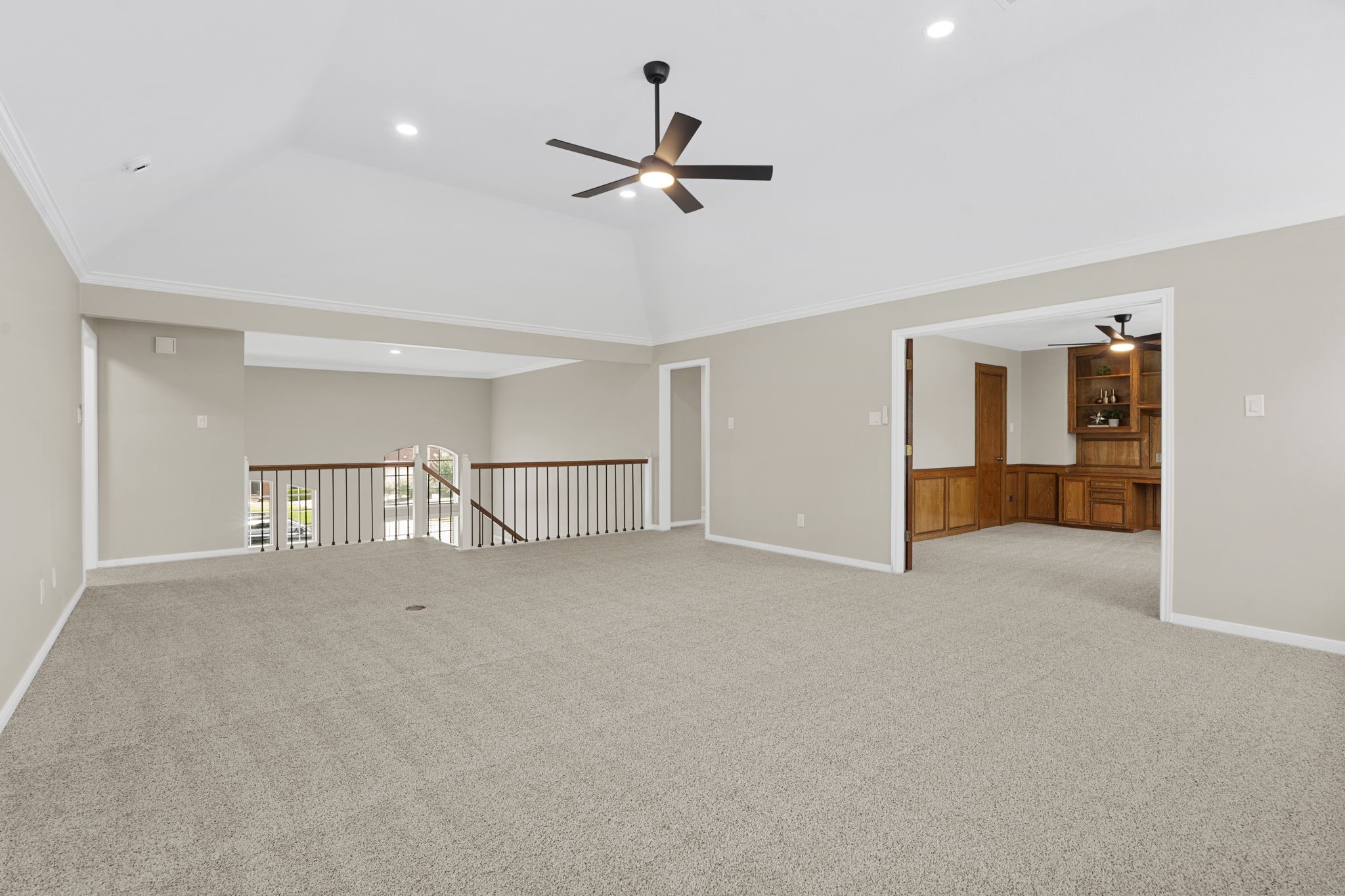 The expansive upstairs game room offers exceptional flexibility for a secondary living area, play space or media retreat, with convenient access to the private study.