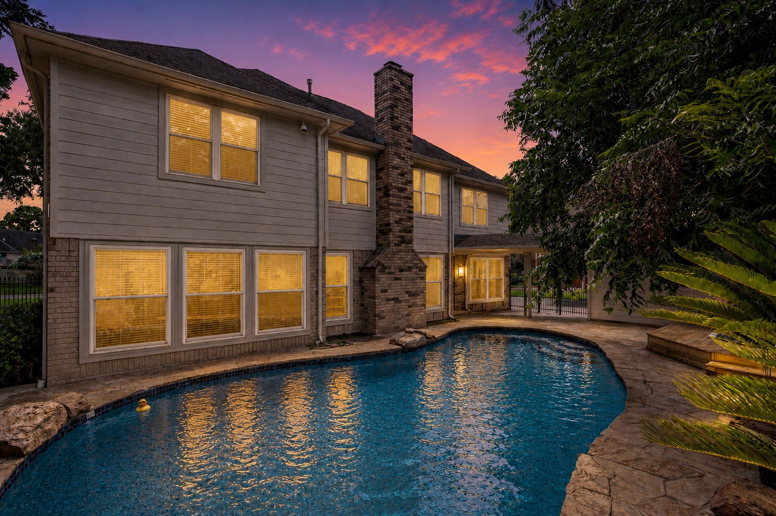 The backyard unfolds into a private outdoor retreat with a sparkling pool, expansive decking & lush mature landscaping. A separate hot tub deck offers another inviting space to unwind while enjoying the peaceful surroundings. The backyard unfolds into a private outdoor retreat with a sparkling pool, expansive decking & lush mature landscaping. A separate hot tub deck offers another inviting space to unwind while enjoying the peaceful surroundings.