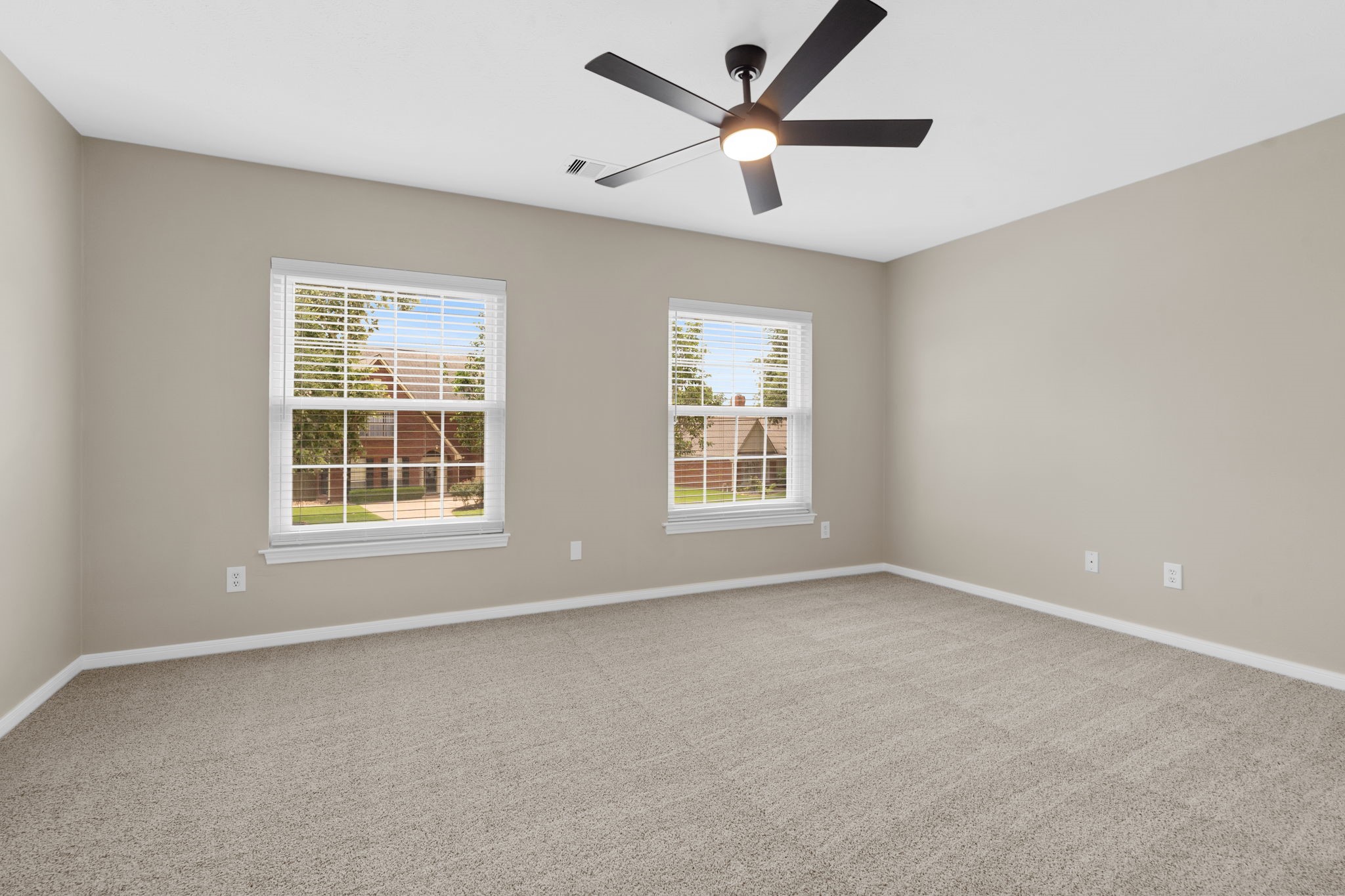 Another generously sized secondary bedroom offers abundant natural light, fresh neutral finishes & plenty of flexibility for guests or family.