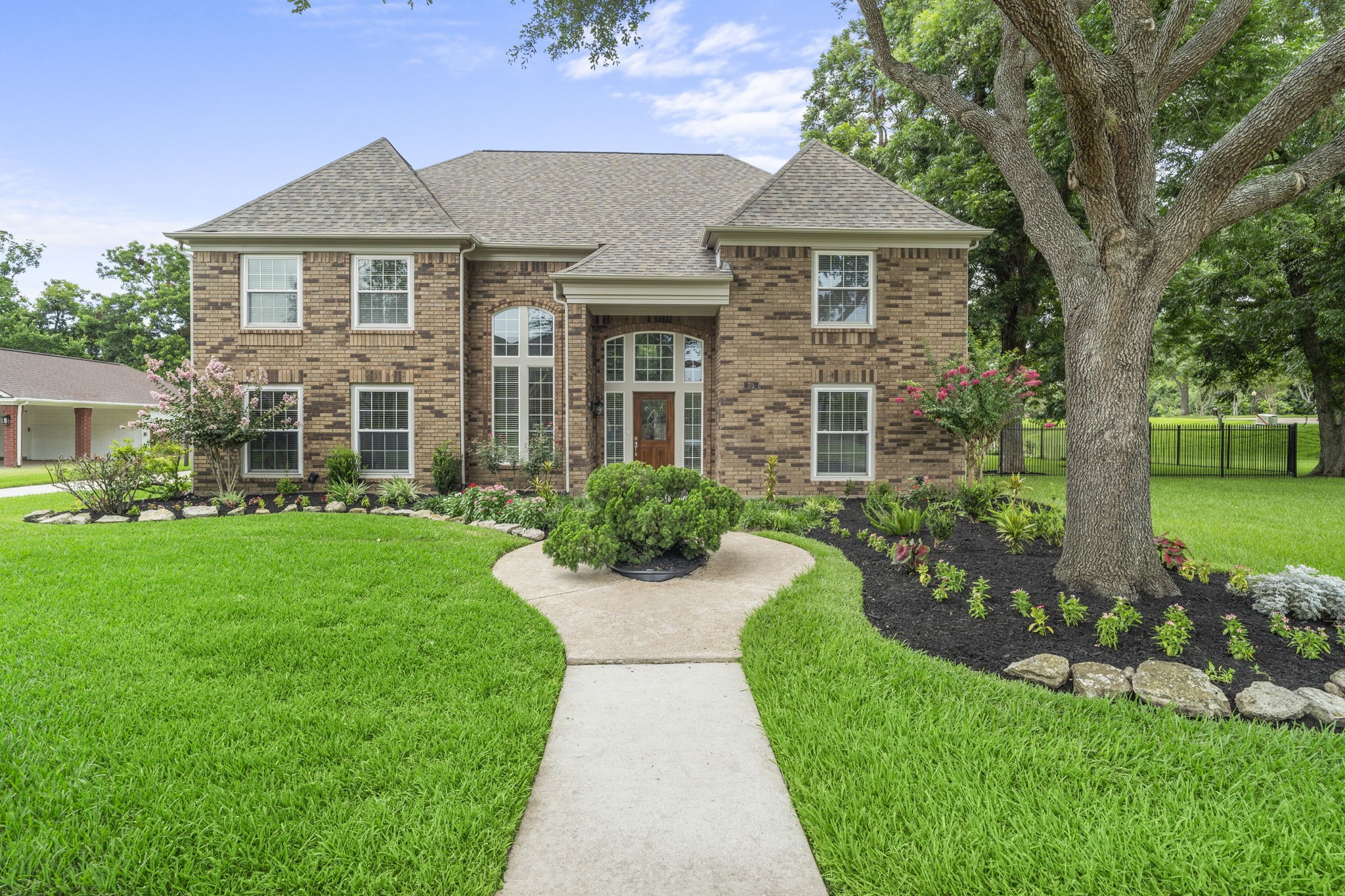 A stately brick exterior is complemented by a grand two-story entry, mature trees & beautifully refreshed landscaping, creating an impressive welcome from the moment you arrive.