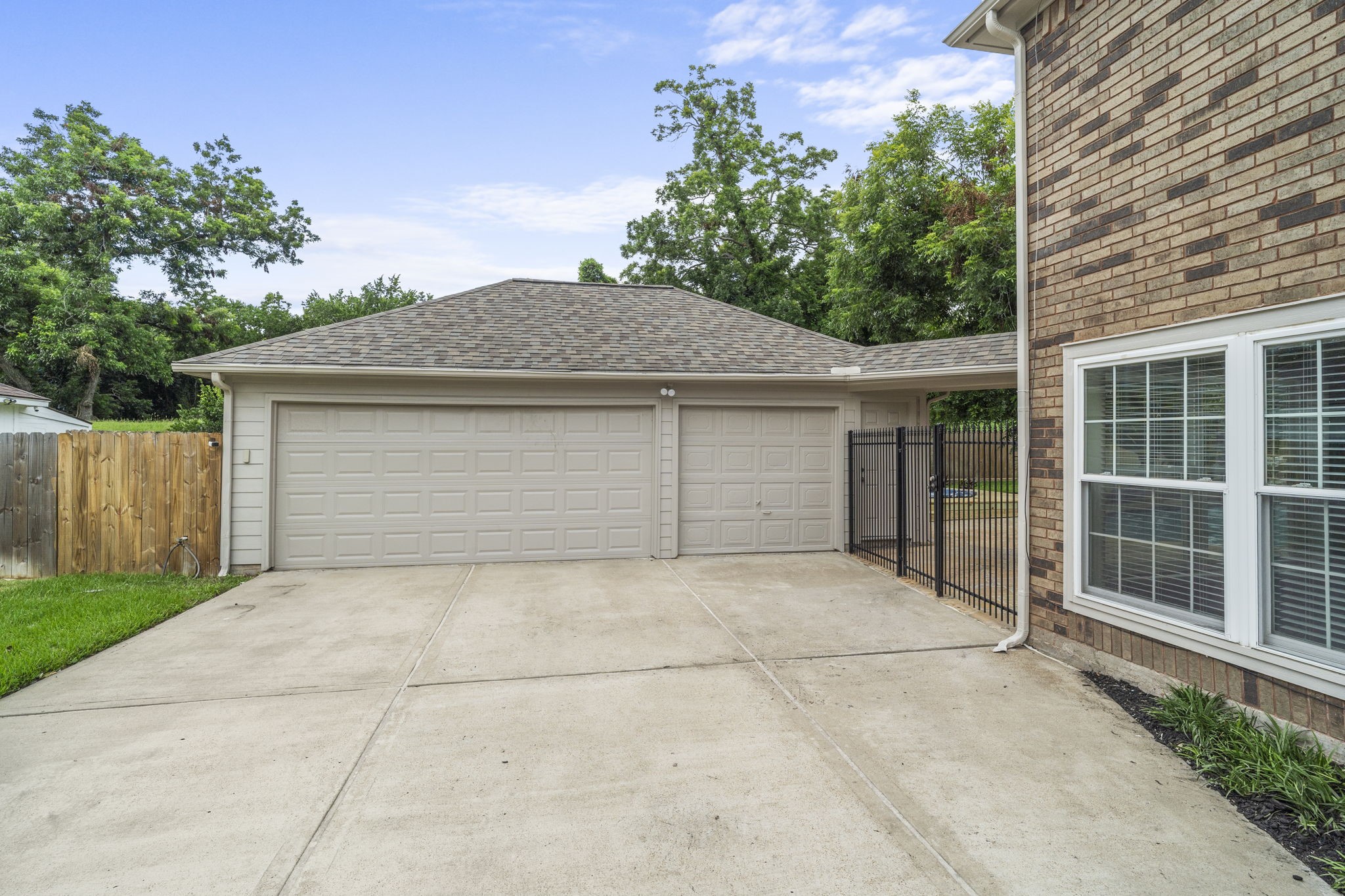 A detached 3-car garage provides exceptional parking & storage, with gated access connecting directly to the backyard.