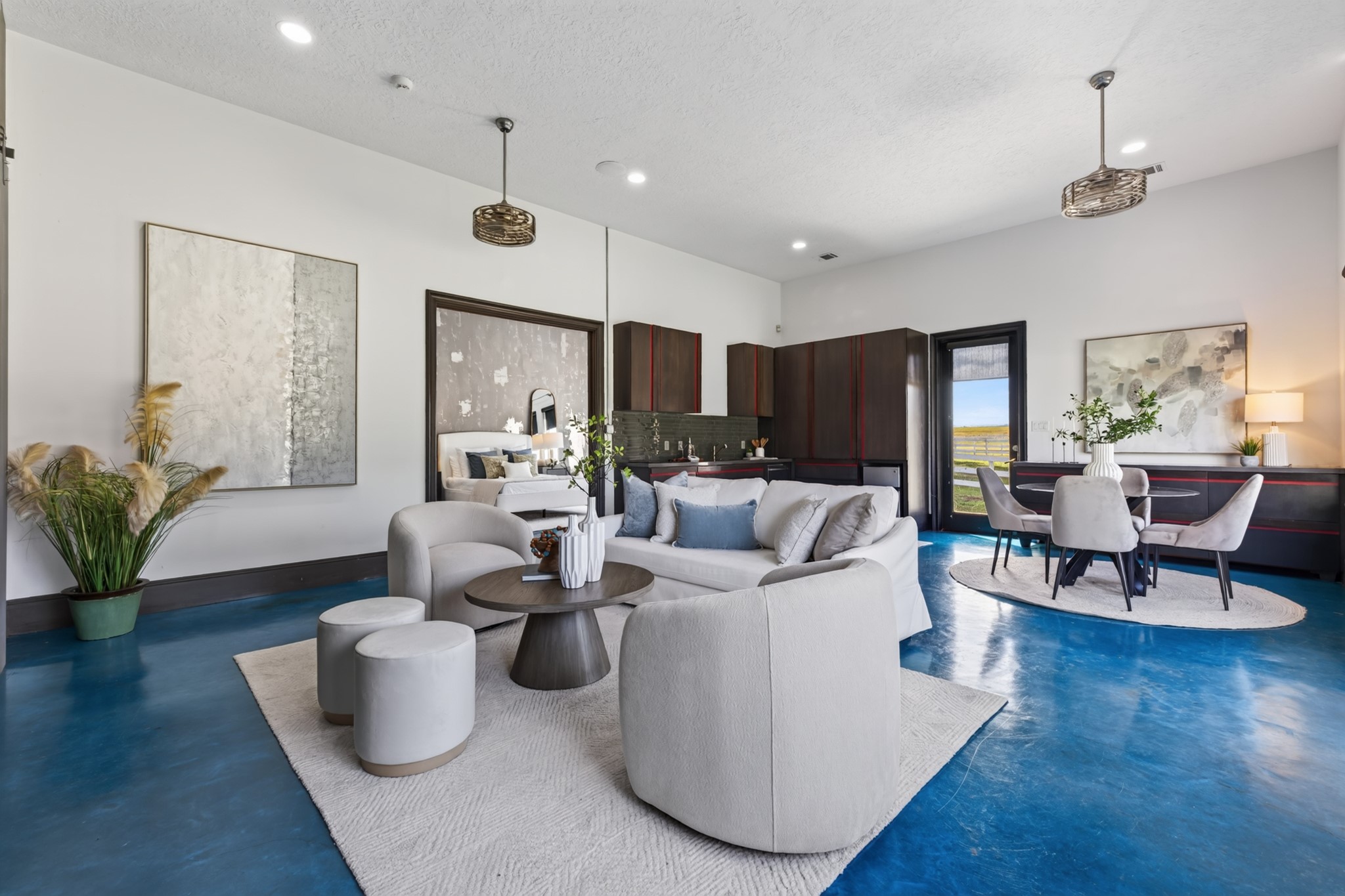 Bold blue floors give the Guest Quarters' gathering space a joyful, unforgettable personality.