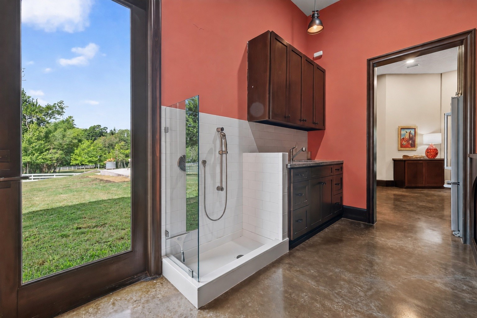 A dedicated pet-washing station adds thoughtful luxury for the family's four-legged companions.