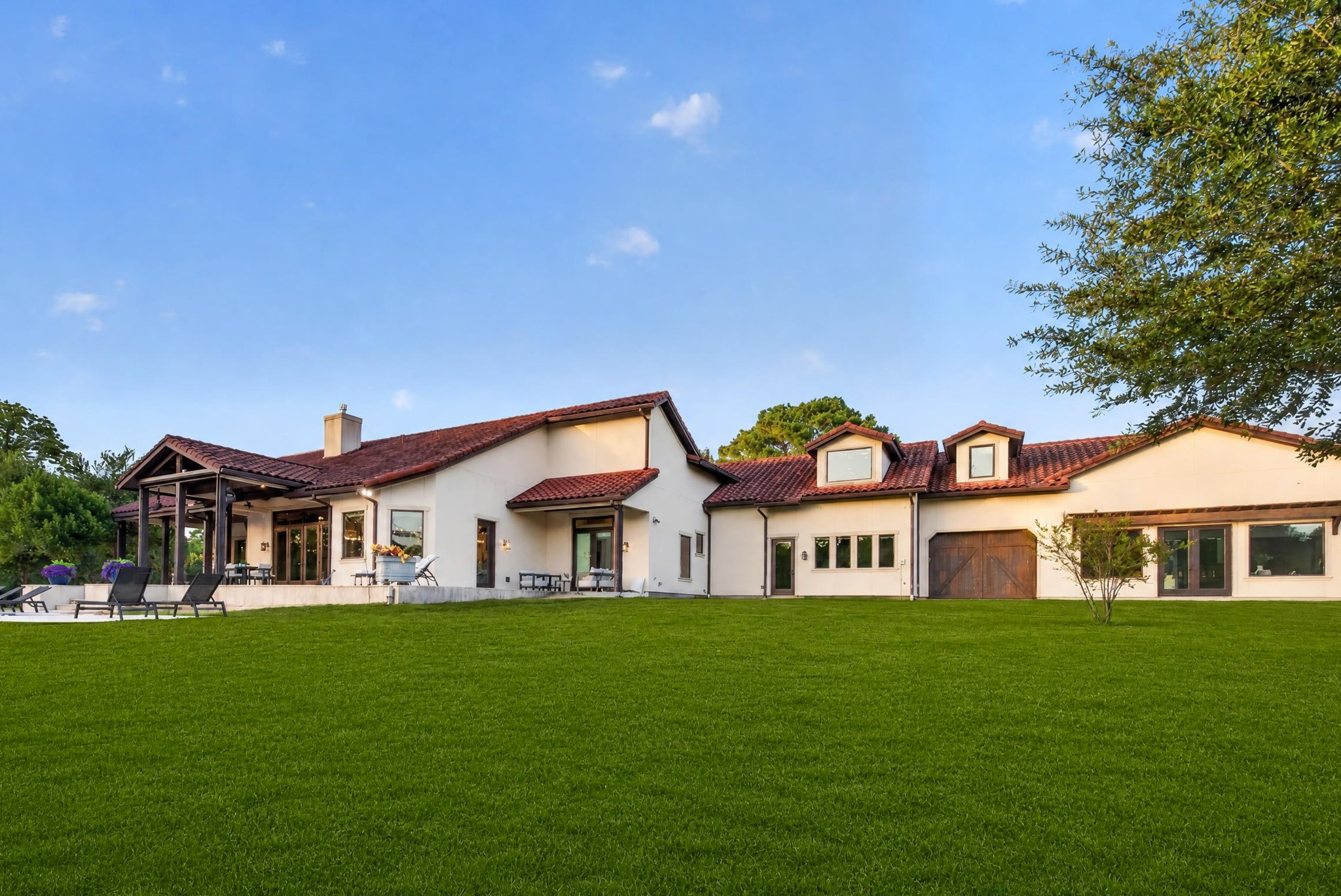 An expansive lawn gives children, pets and guests room to run, gather and celebrate.