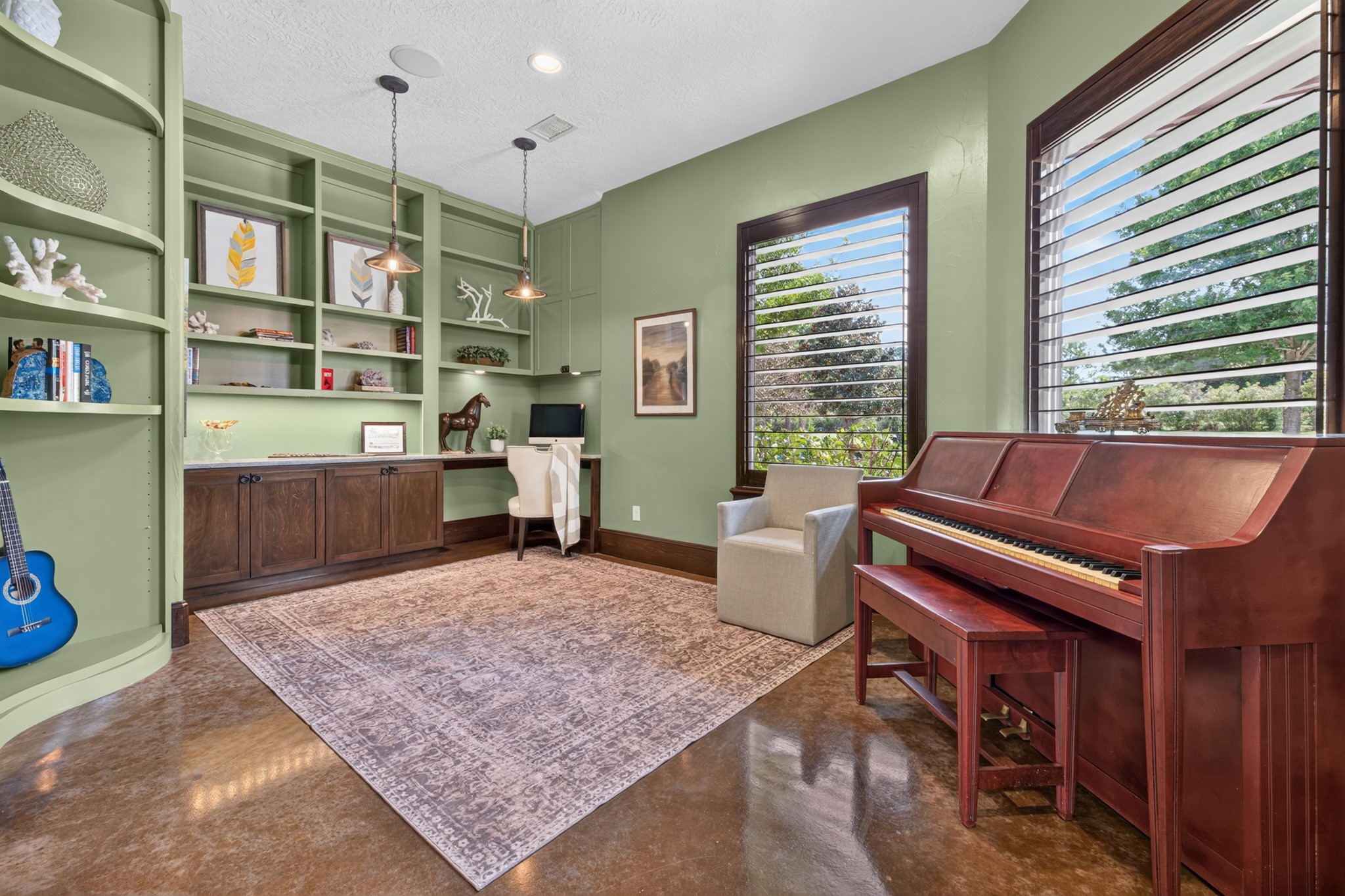 A refined office and music room offers a beautiful setting for work, creativity and reflection.