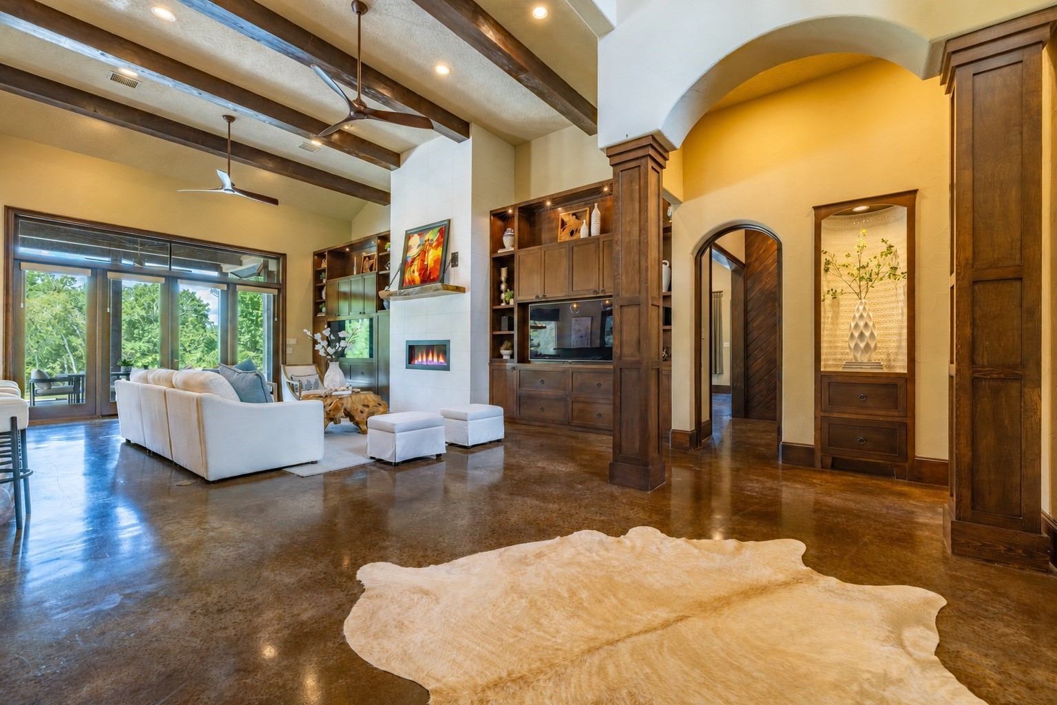 Soaring beams, walls of light and pool views make this the heart of family life.