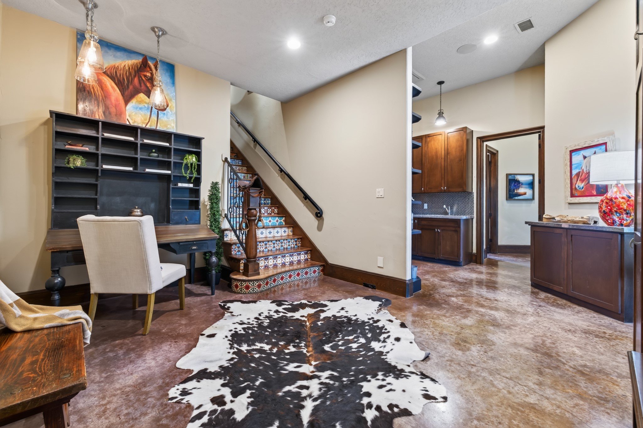 The welcoming mudroom keeps boots, bags and busy family life beautifully organized.