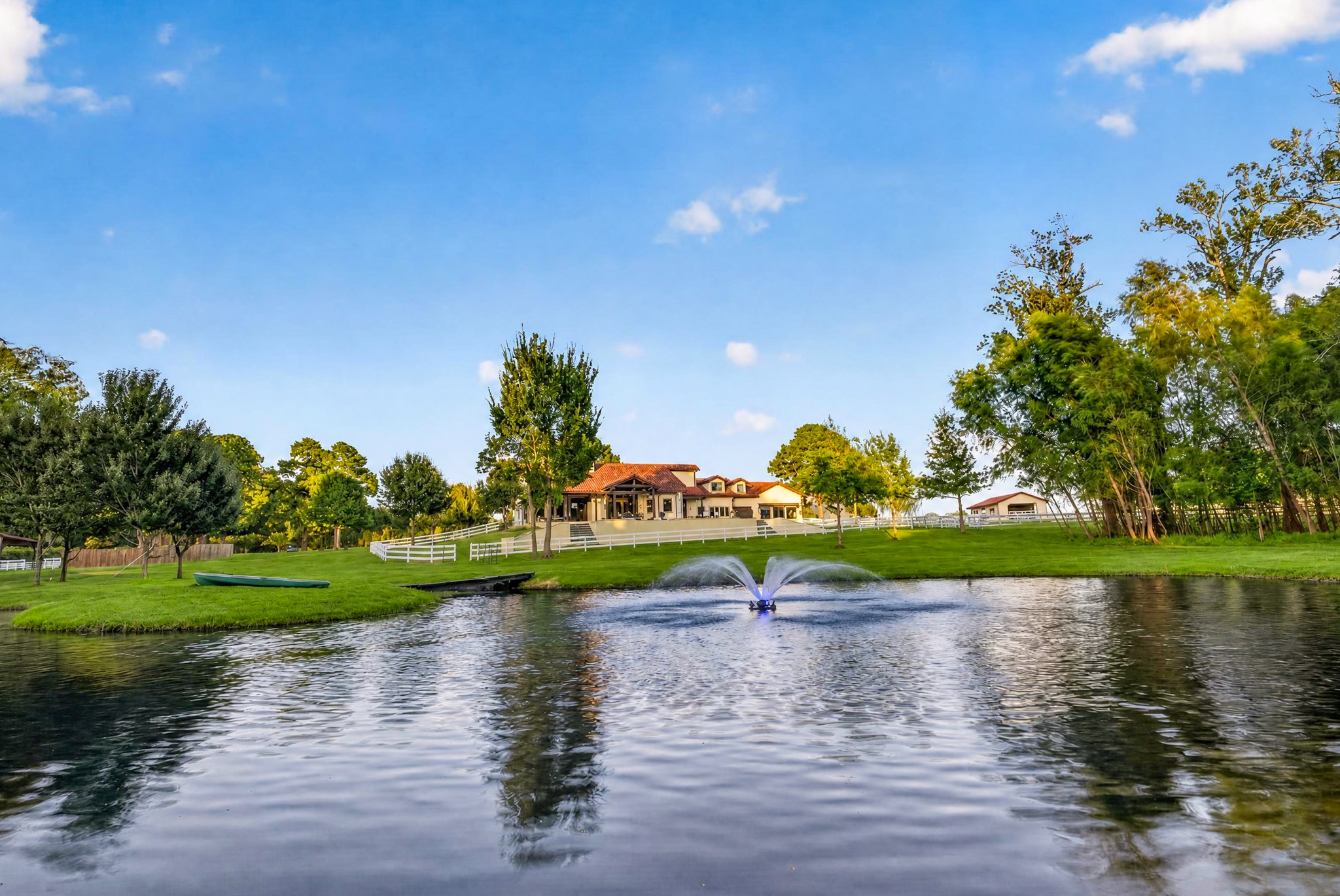Welcome to our own oasis with an intentionally placed stocked pond that invites evening fishing, island picnics and quiet kayak rides.