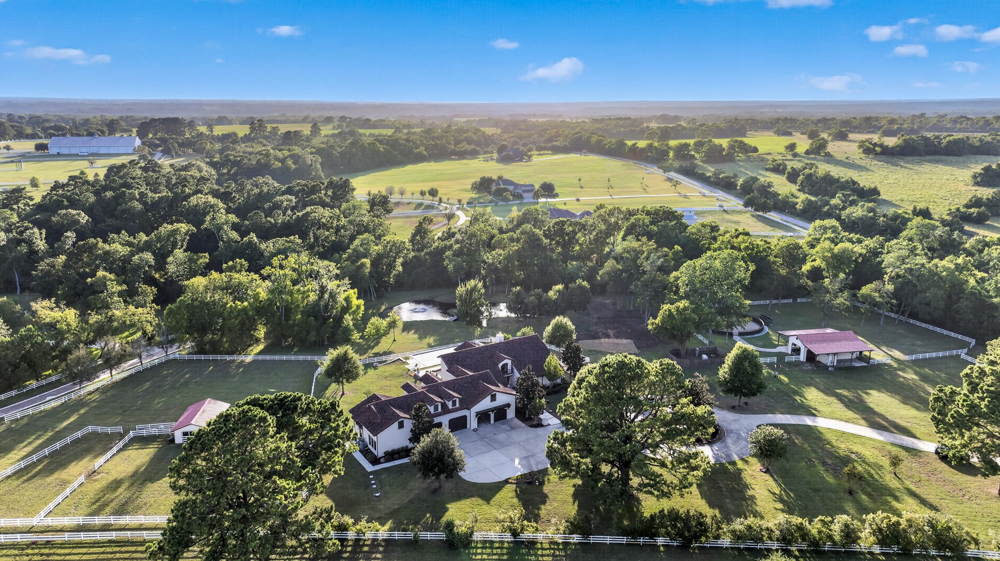 More than eight private acres unfold with a pool, pond, pasture and your own private resort.