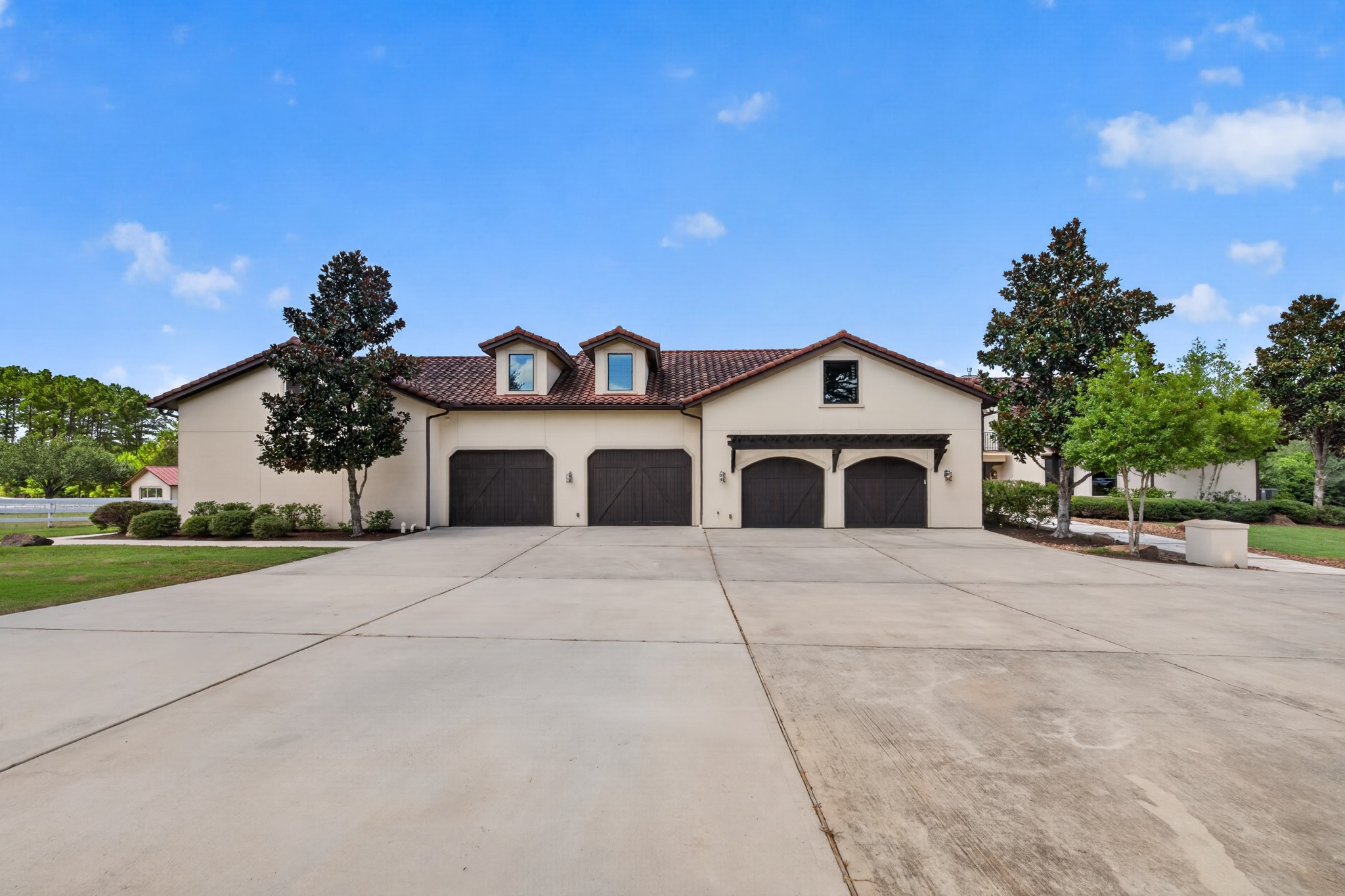 A four to six car garage and grand motor court provide space for vehicles, equipment and every adventure.