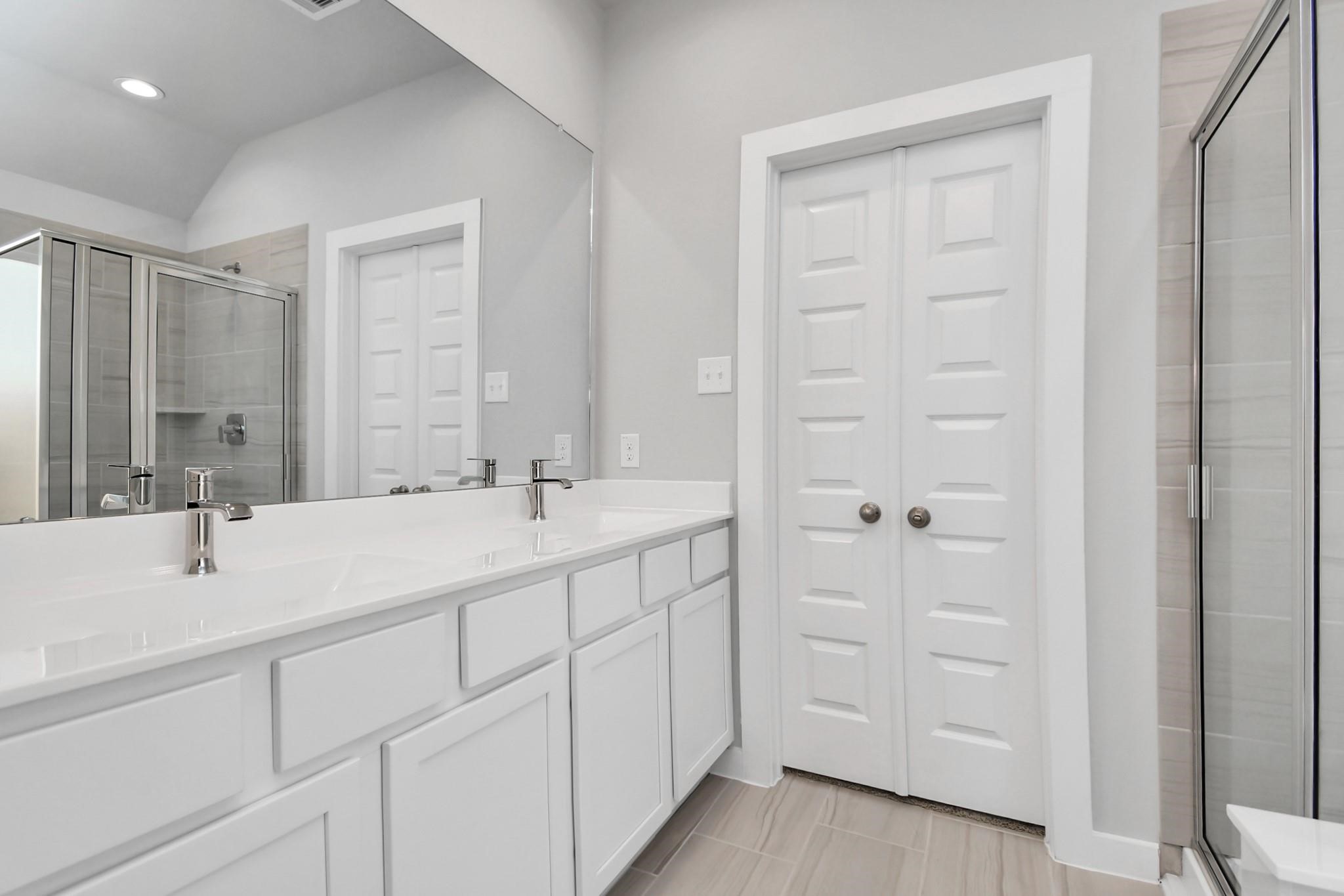 Double sinks in primary bathroom.