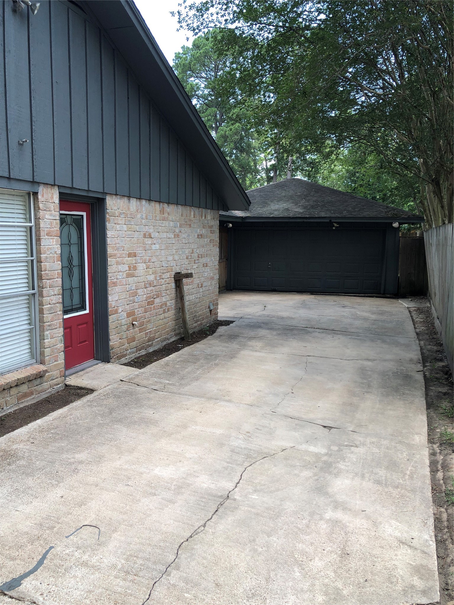 Long driveway to rear detached garage Long driveway to rear detached garage