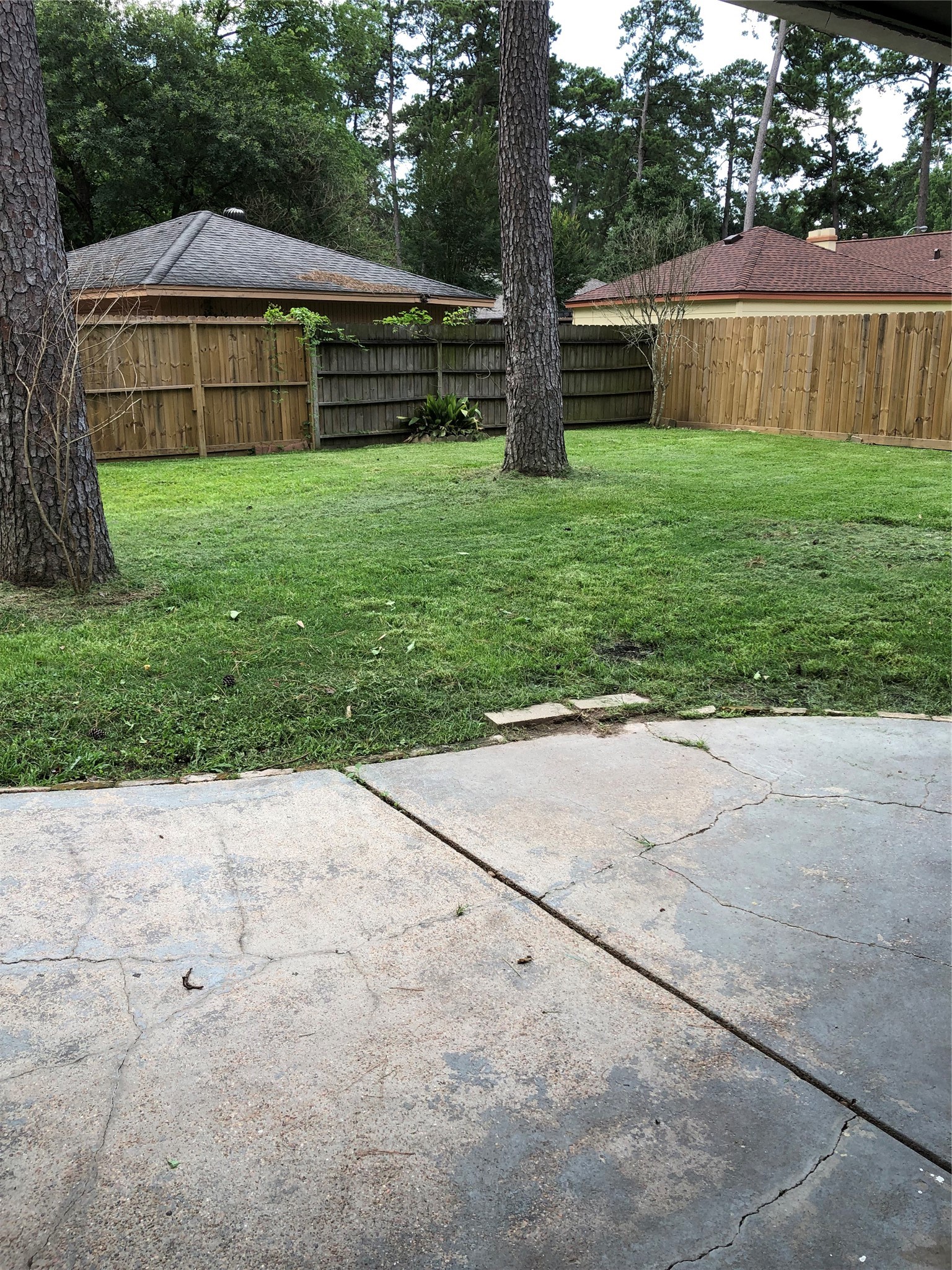 Fenced back yard with covered patio