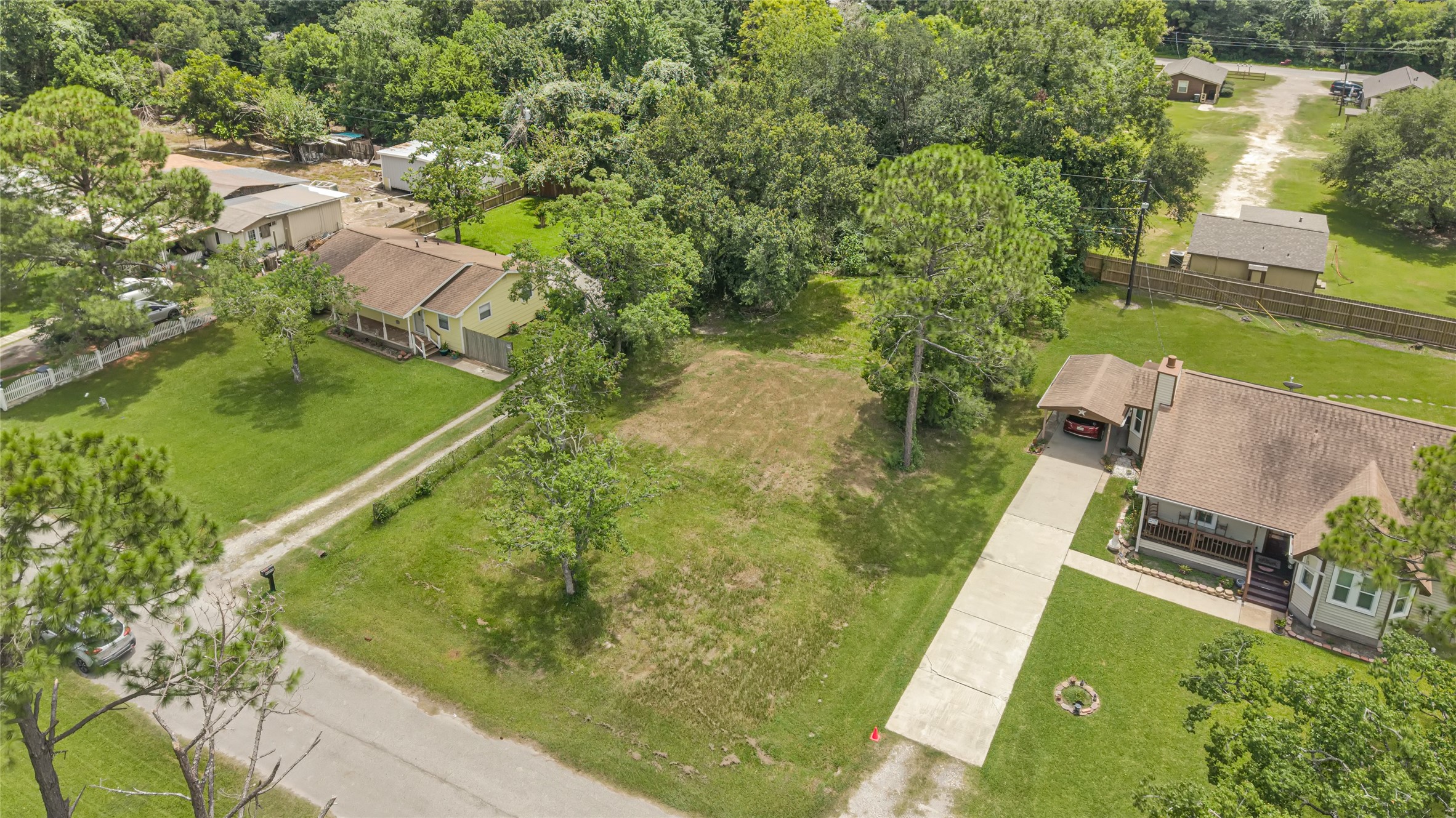 Spacious lot surrounded by lush greenery and mature trees, offering a peaceful setting with easy access to nearby homes. Ideal for building your dream home in a serene neighborhood.