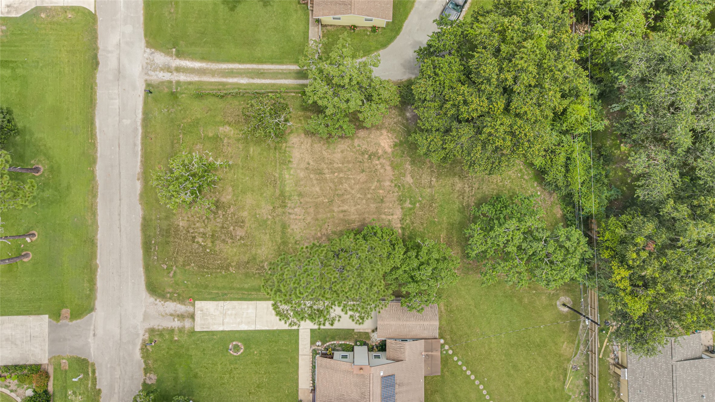 Spacious vacant lot nestled in a tranquil neighborhood, surrounded by lush greenery and mature trees, offering an ideal canvas for your dream home. Spacious vacant lot nestled in a tranquil neighborhood, surrounded by lush greenery and mature trees, offering an ideal canvas for your dream home.