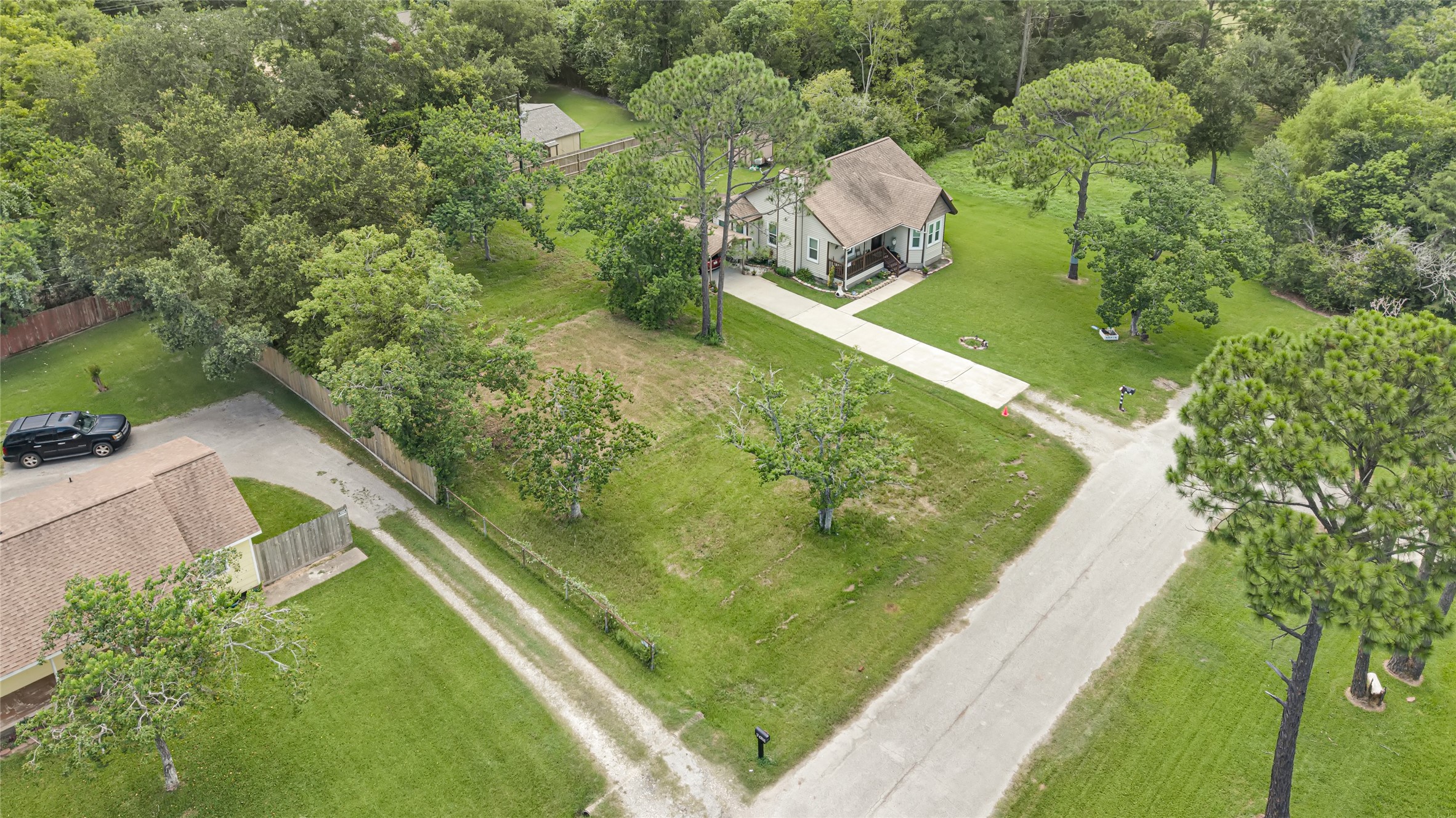 Charming home nestled among mature trees with a spacious front yard and a long driveway offering ample parking. Charming home nestled among mature trees with a spacious front yard and a long driveway offering ample parking.