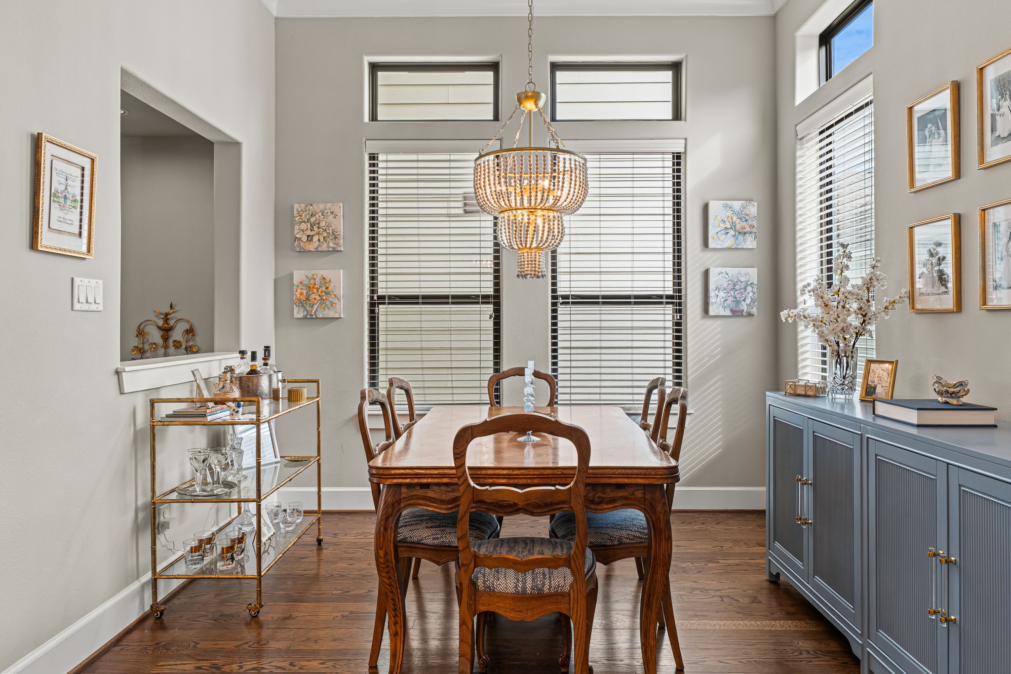A window-lined corner makes dining room feel bright and intimate. Crown molding traces the ceiling above, lending everyday meals a sense of occasion. A window-lined corner makes dining room feel bright and intimate. Crown molding traces the ceiling above, lending everyday meals a sense of occasion.