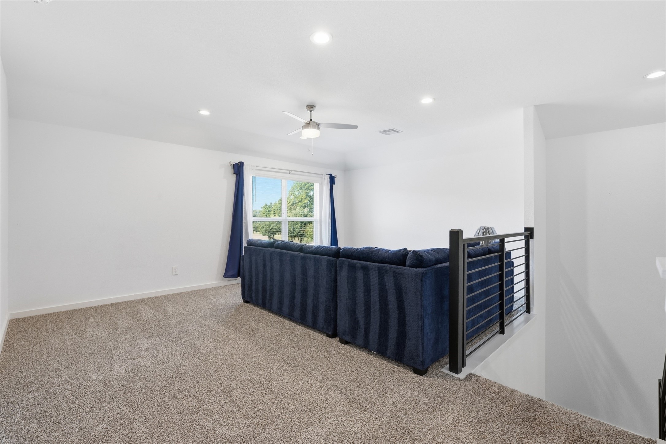 Spacious Game room allows for multiple furniture configurations and still have room for play.