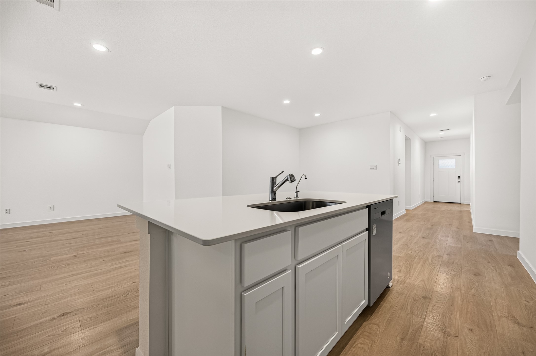 Quartz countertops, undermount sink, water filtration system and extra storage in the island.