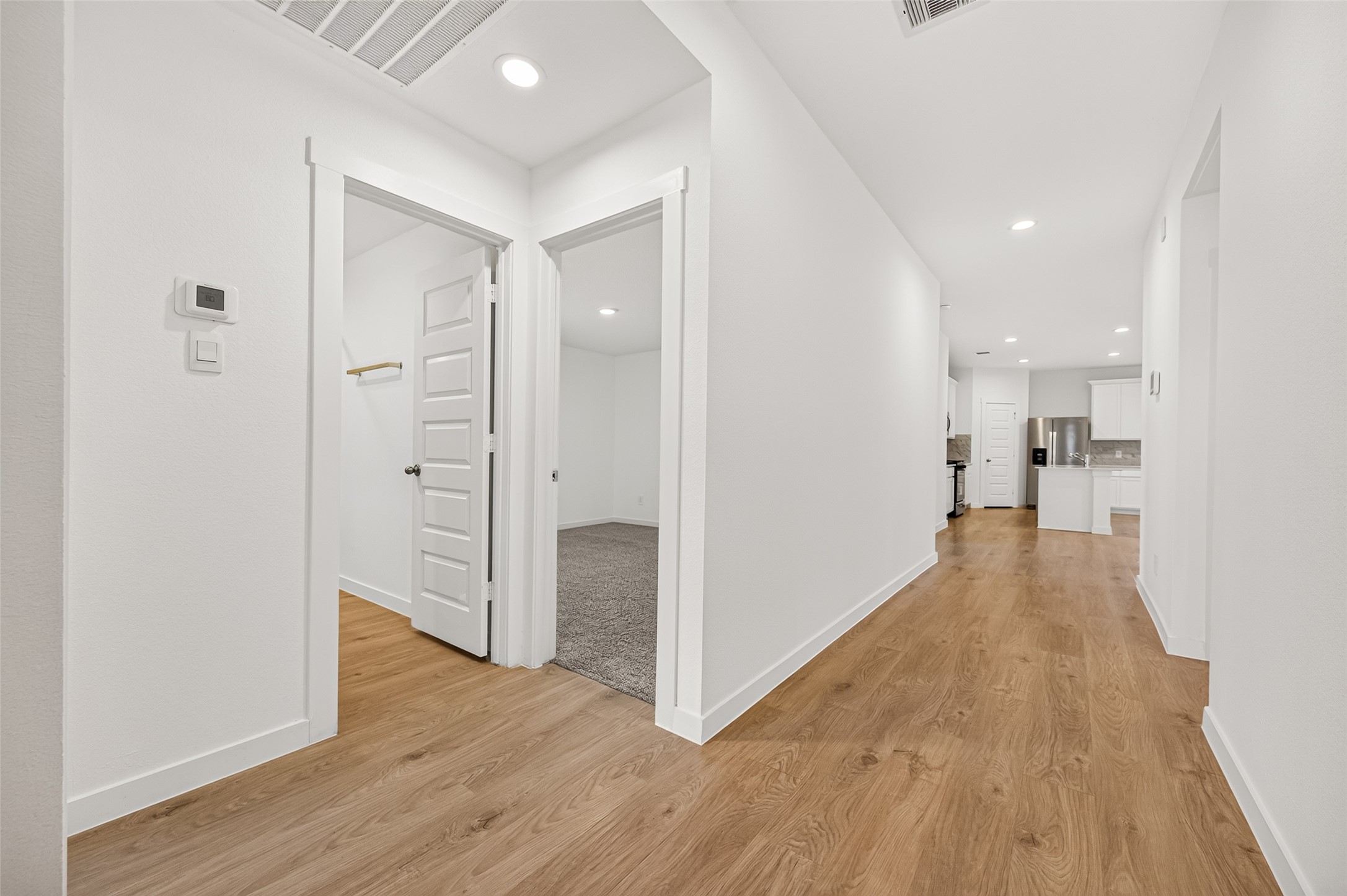 View when you first enter your new home. Two guest bedrooms to the left with a bathroom to share.
