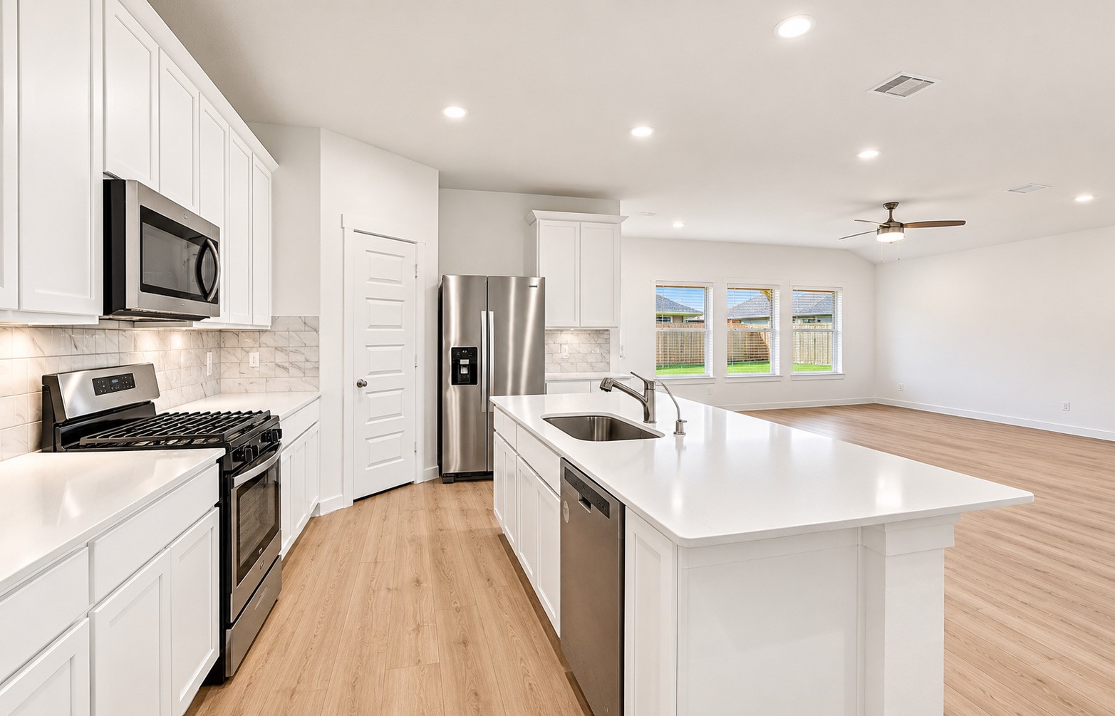 Gas stovetop, built in microwave and plenty of counter and cabinet space.