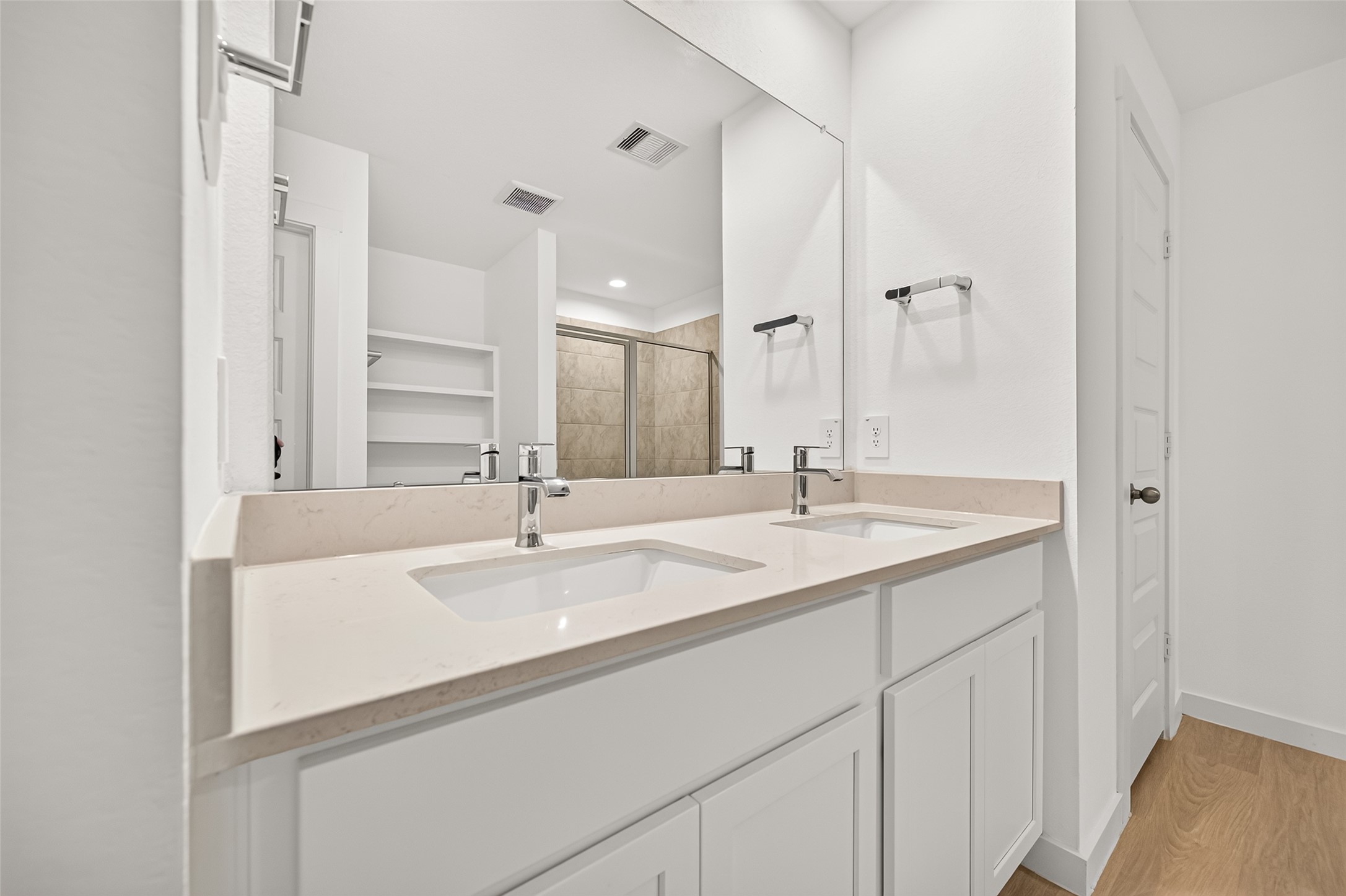 Quartz counters, his/ her sinks and lots of storage.