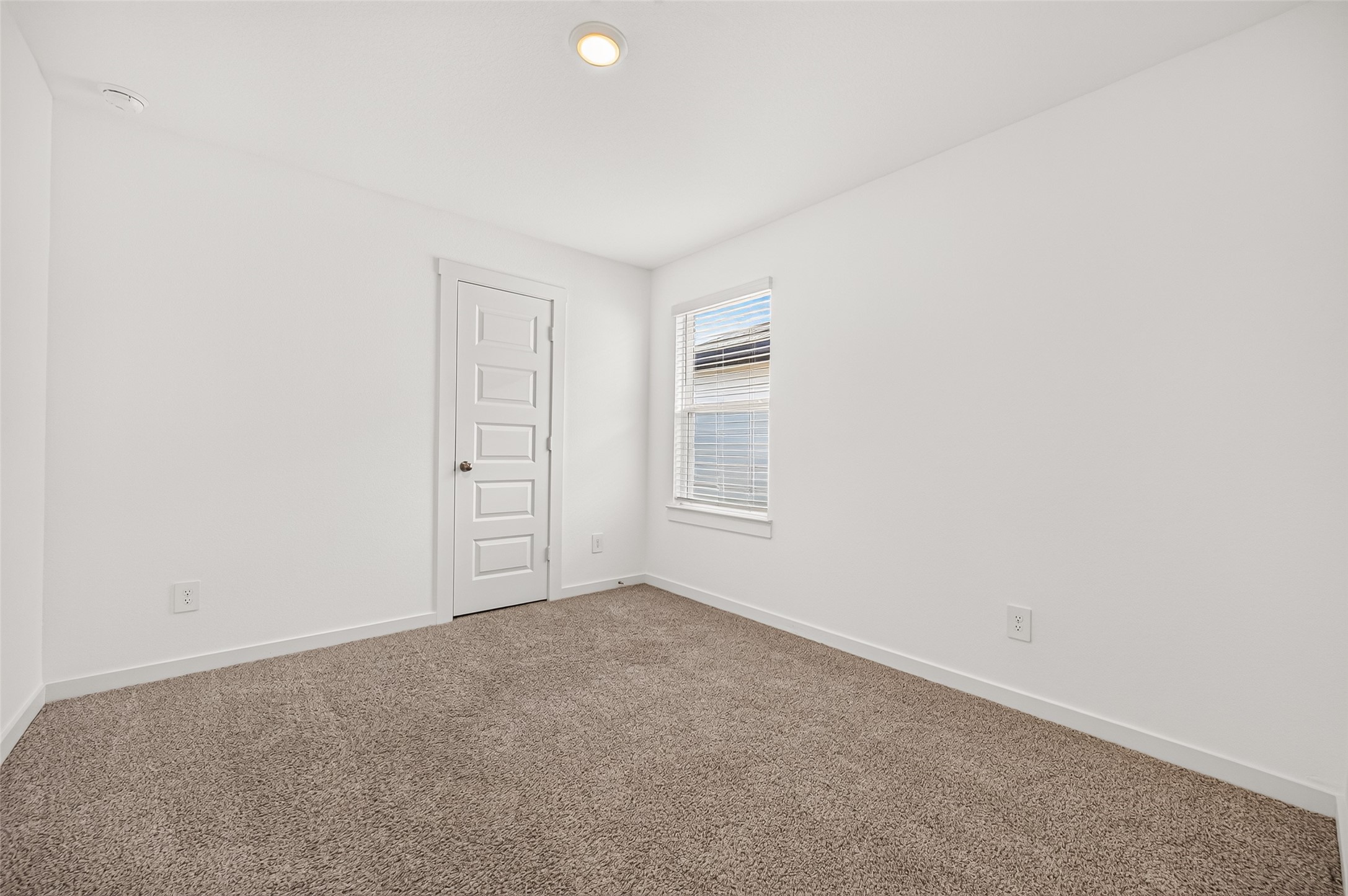 Laundry room, washer/ dryer and shelving.