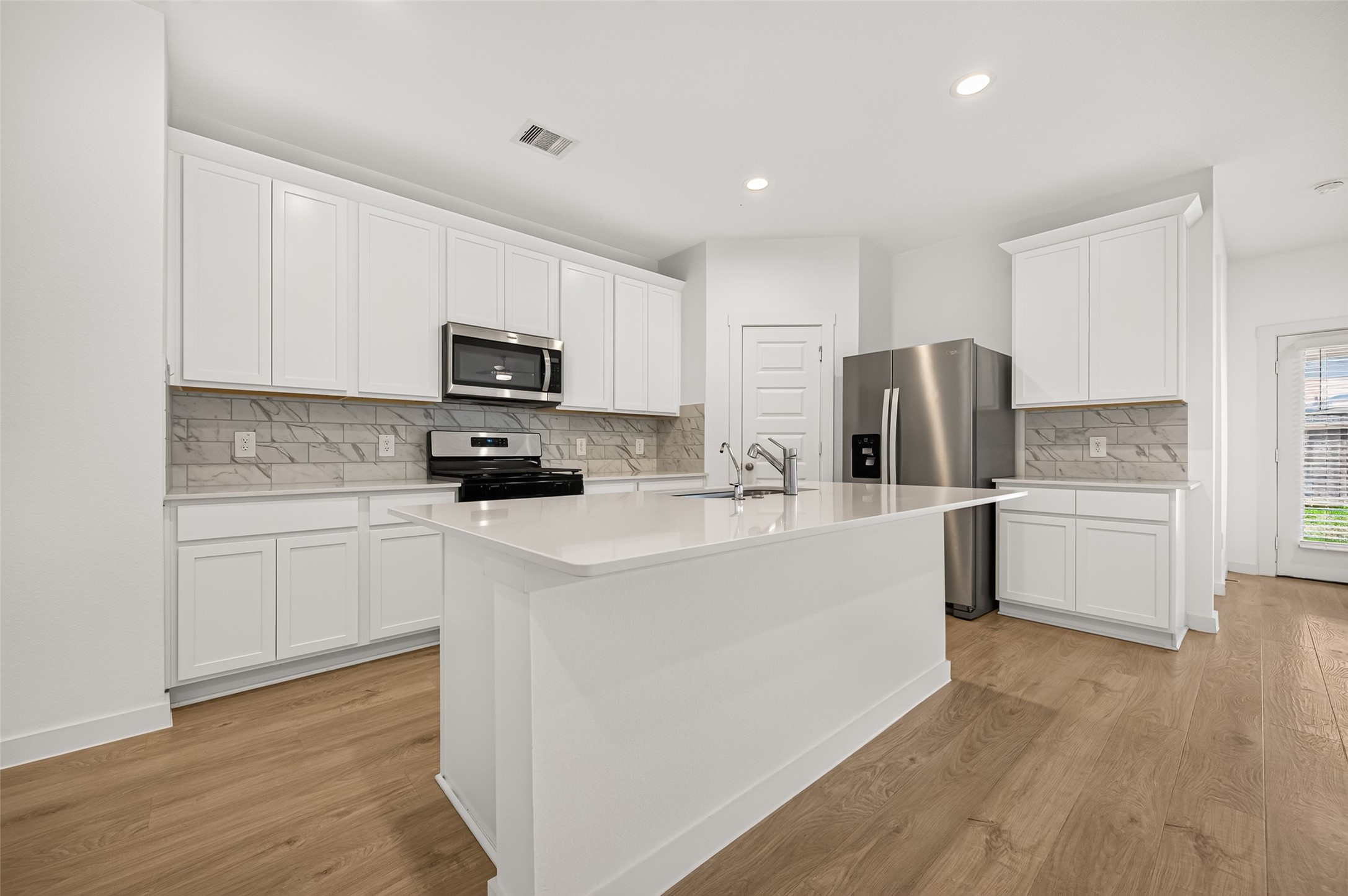 Well-appointed kitchen with all the upgrades. Walk in pantry and canned lighting. Stainless appliances.