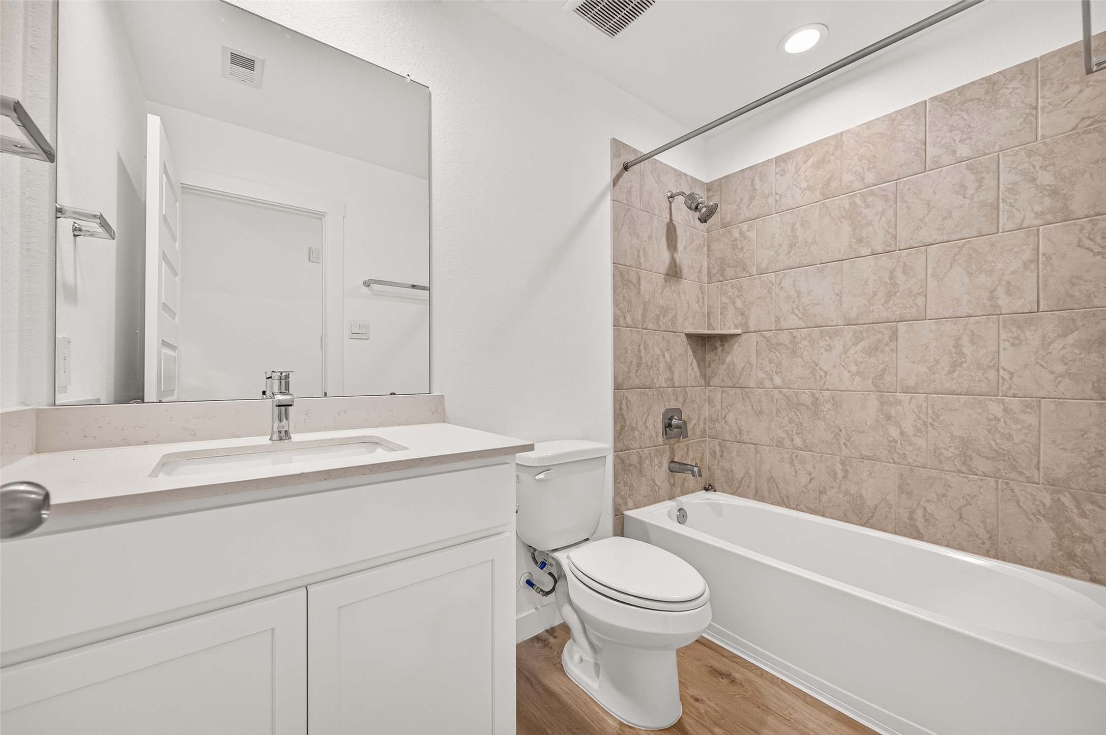 The first guest bathroom sits between bedrooms 1 & 2 in the front of the home.