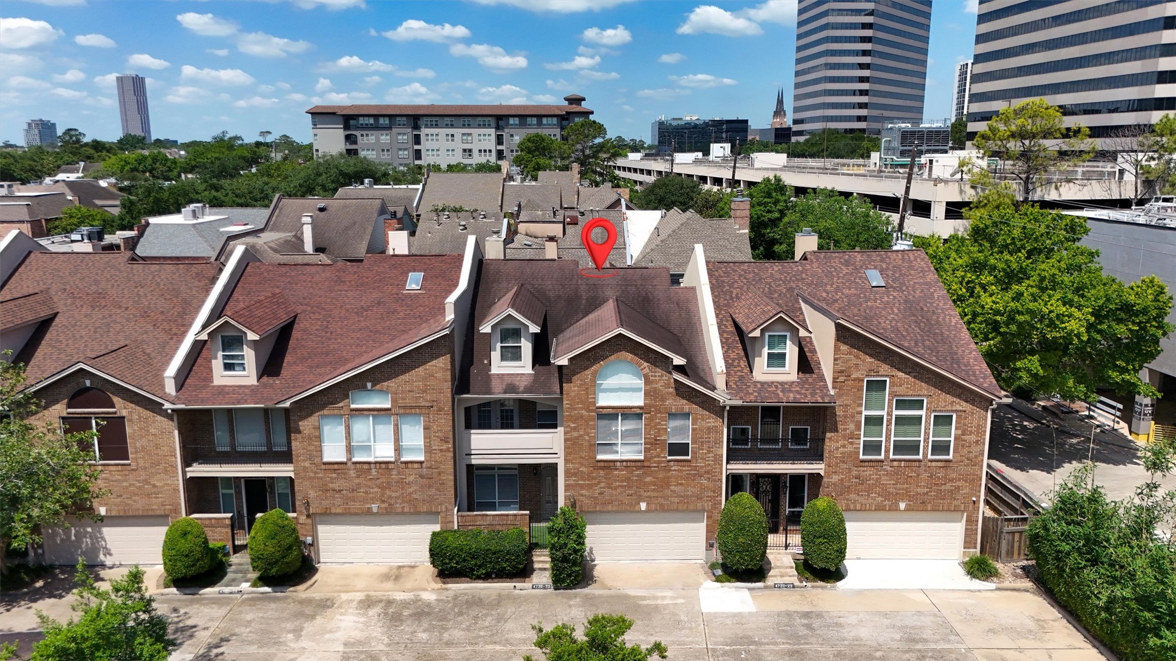Classic brick exterior with timeless curb appeal and upscale community setting.