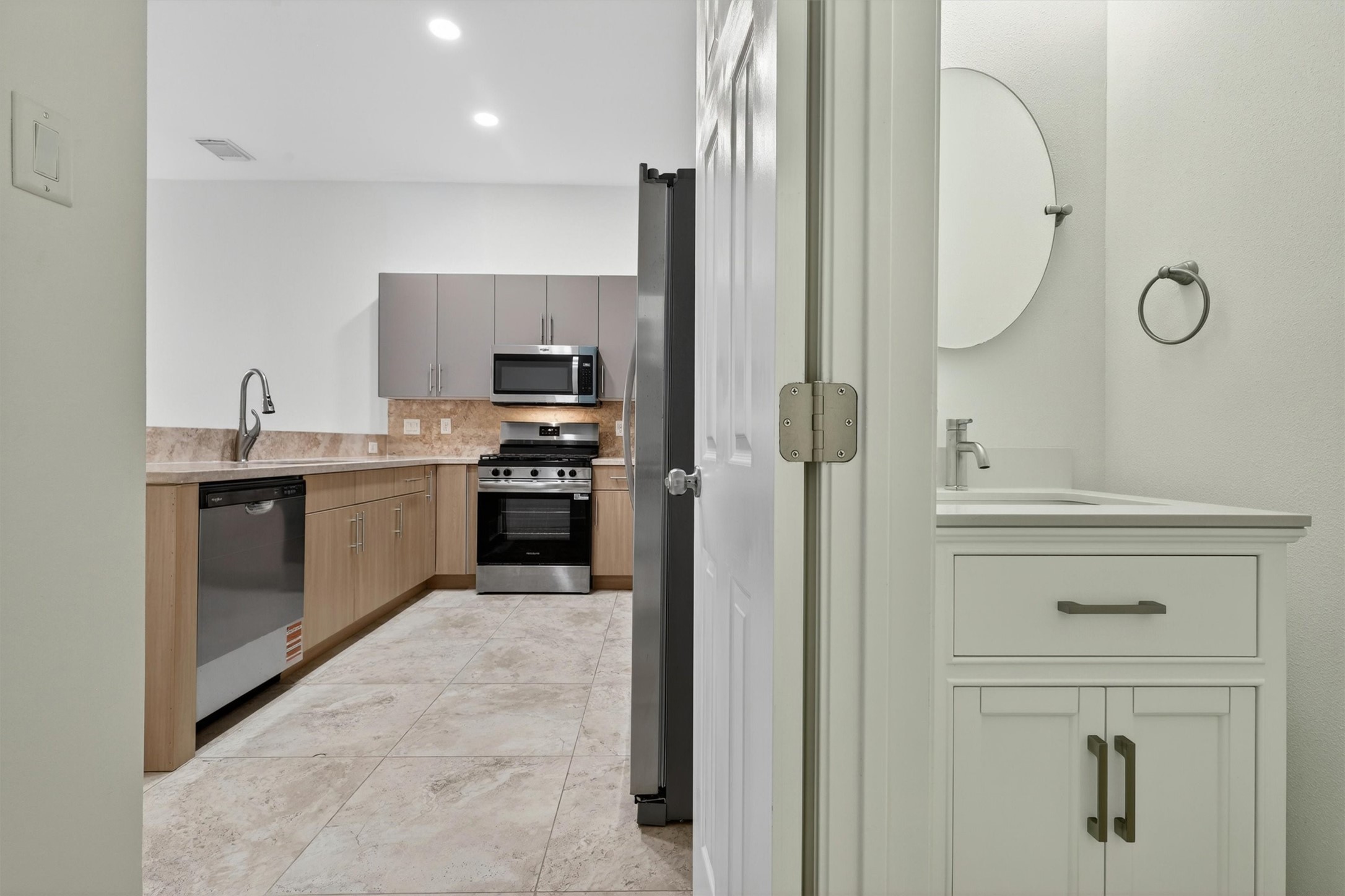 Soft-close cabinetry and premium storage solutions throughout the kitchen.