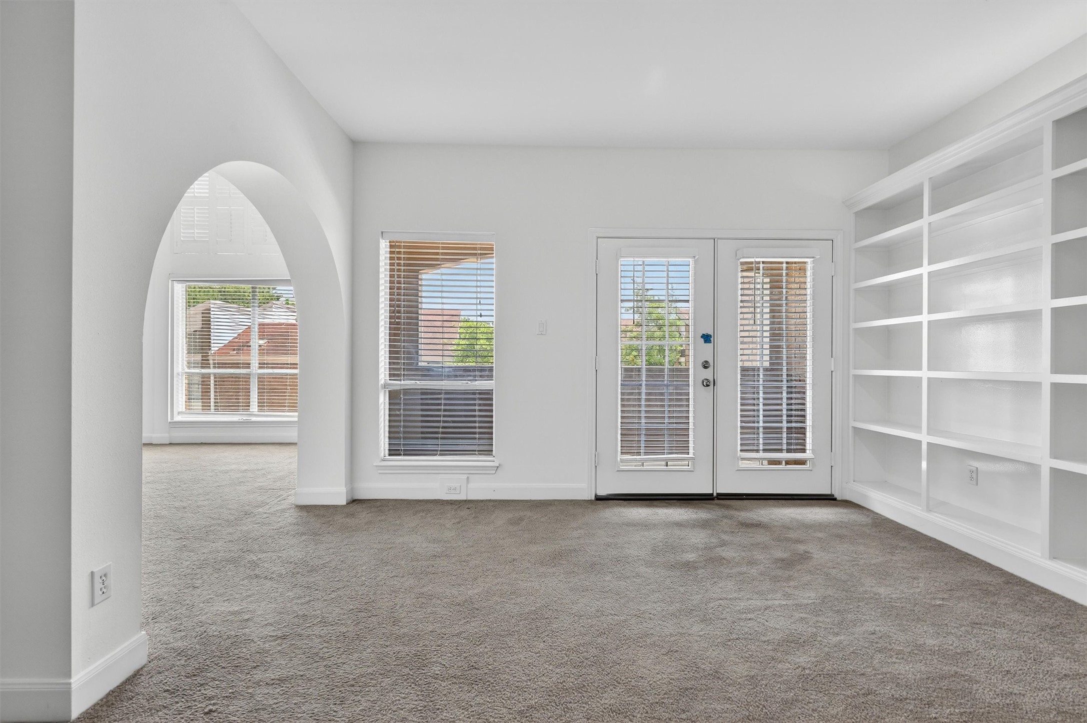 Versatile flex space ideal for home office, reading area, or workout room.