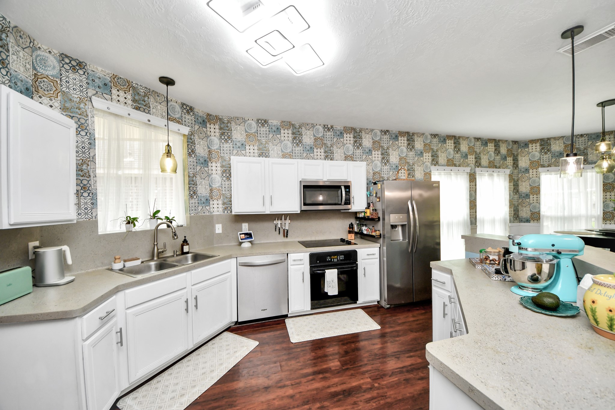 An efficient kitchen layout offers extensive cabinetry and excellent workspace for everyday cooking.