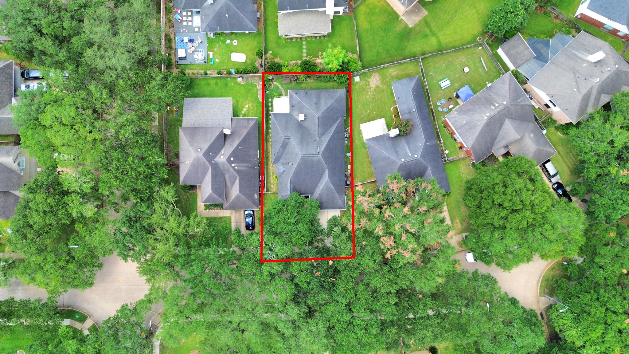 Overhead view highlighting the home, backyard, and approximate property boundaries.
