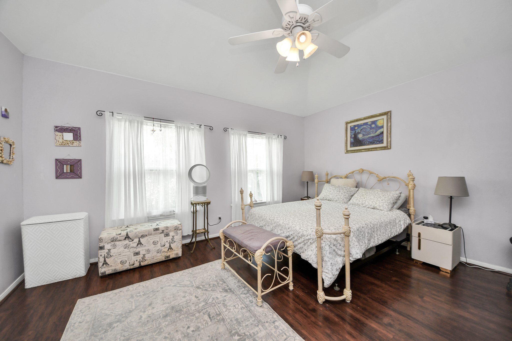 Another view of the spacious primary bedroom and its abundant natural light.