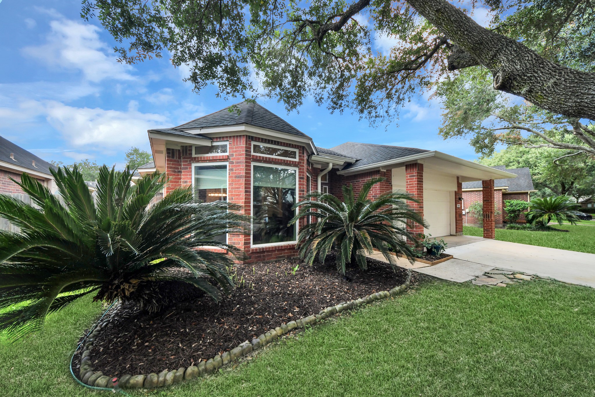 Brick exterior, established landscaping, and oversized front windows give this home plenty of character. Brick exterior, established landscaping, and oversized front windows give this home plenty of character.