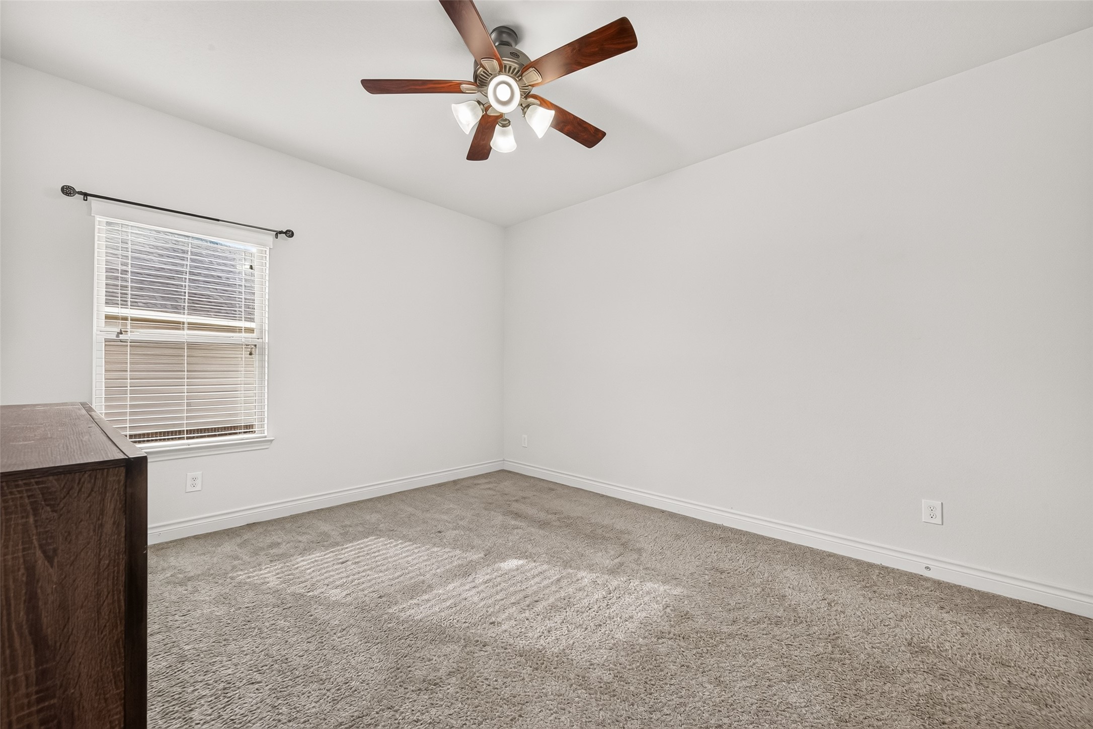 Second-floor secondary bedroom #2 featuring plush carpeting, generous space, and a comfortable layout