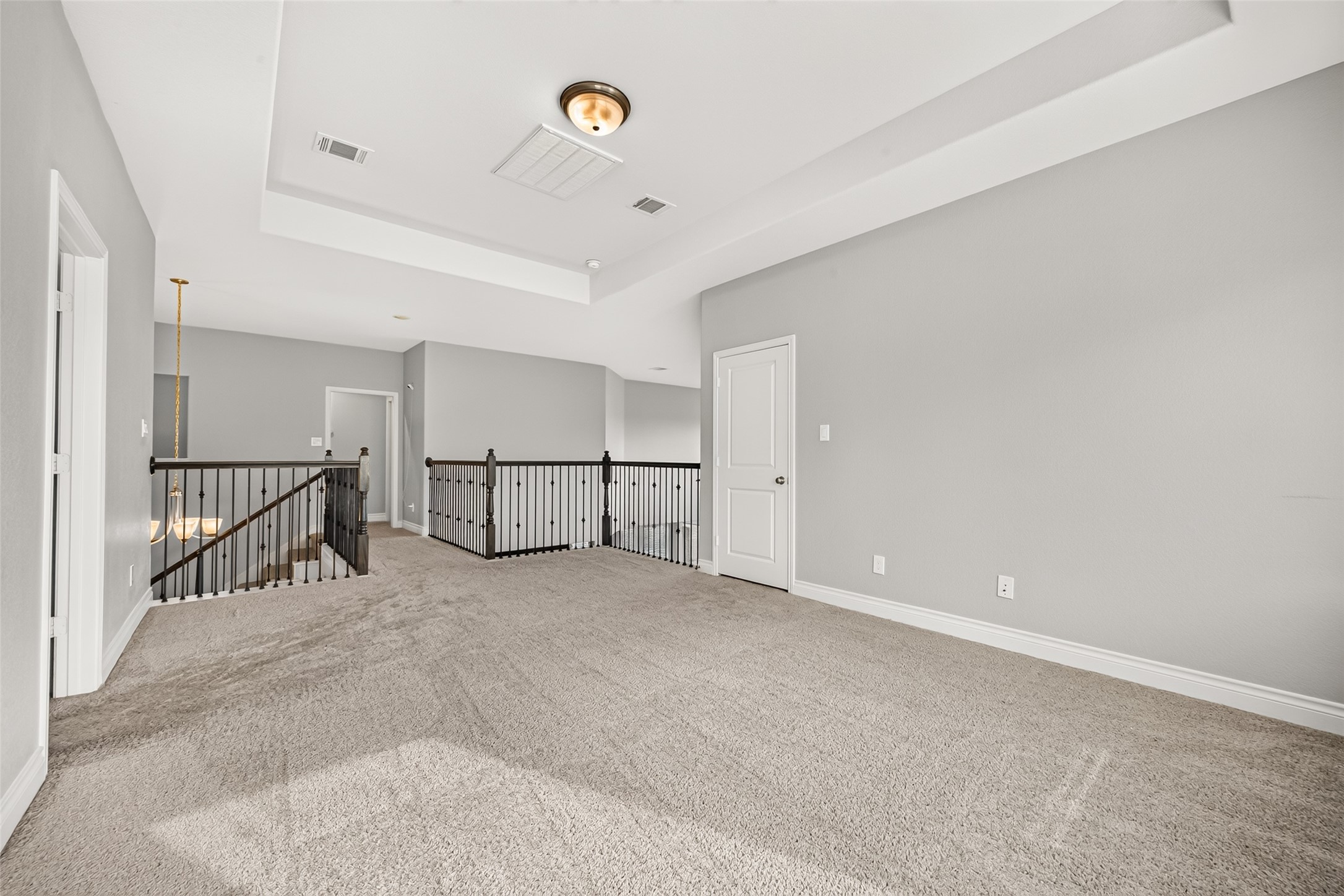 Large game room with large windows offering the perfect space for family fun, game nights, movie marathons, and entertaining guests