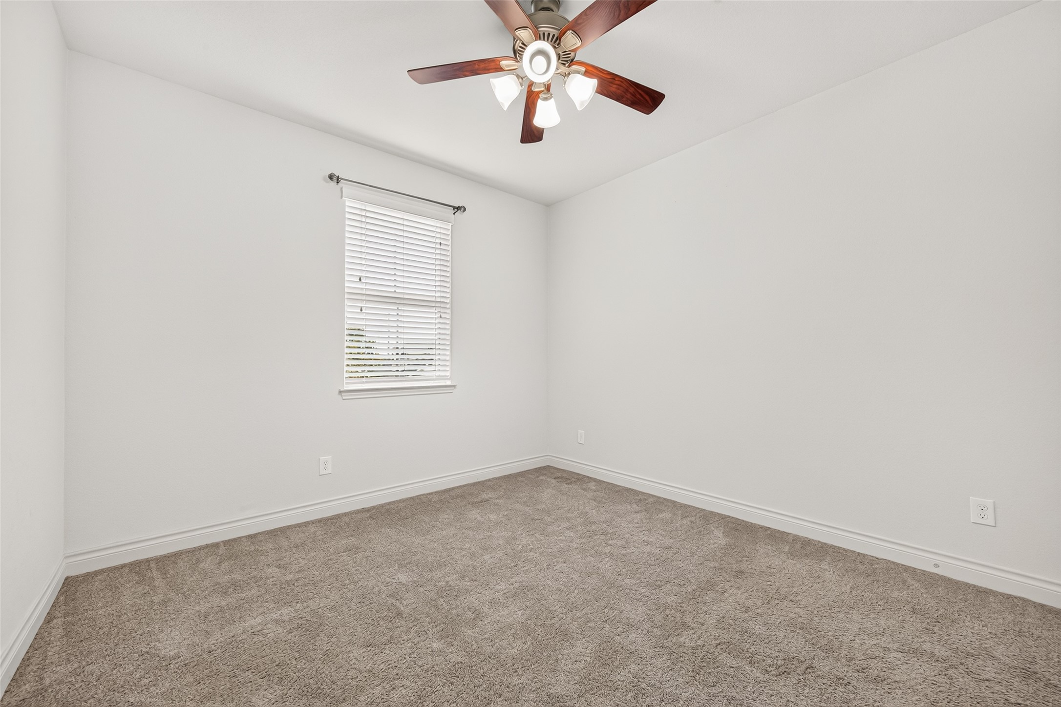Second-floor secondary bedroom #4 featuring plush carpeting, generous space, and a comfortable layout